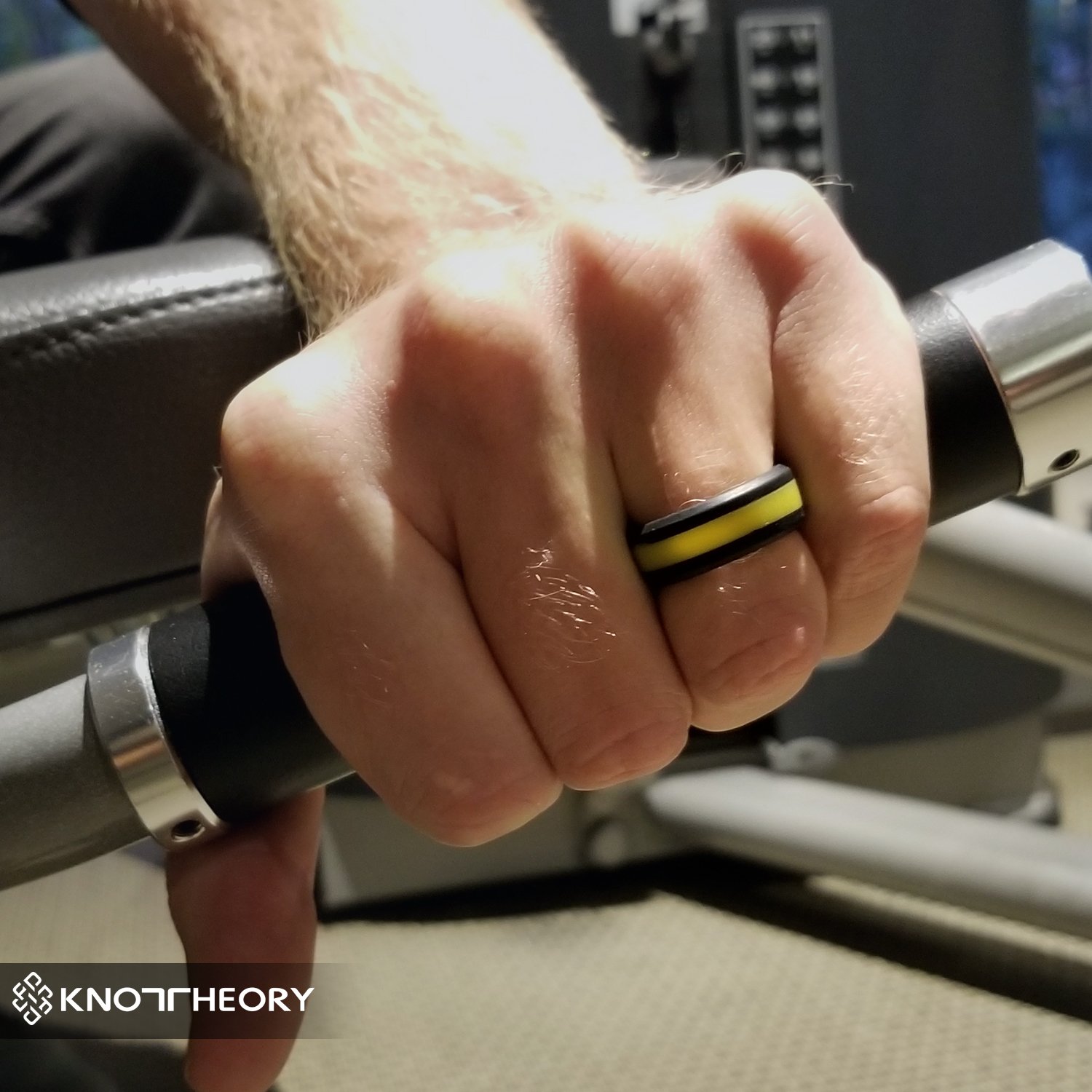 A sleek yellow stripe silicone ring designed for both men and women, featuring a beveled edge and 8mm width for comfort.