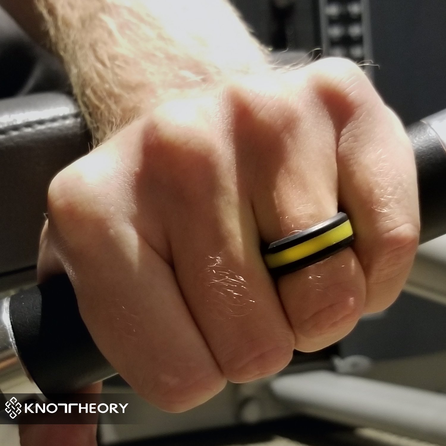 A sleek yellow stripe silicone ring designed for both men and women, featuring a beveled edge and 8mm width for comfort.