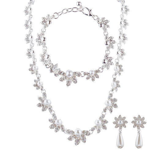 Bridal Wedding Jewelry Crystal Rhinestone Necklace Set featuring floral design with clear crystals and faux pearls, including necklace, bracelet, and earrings.