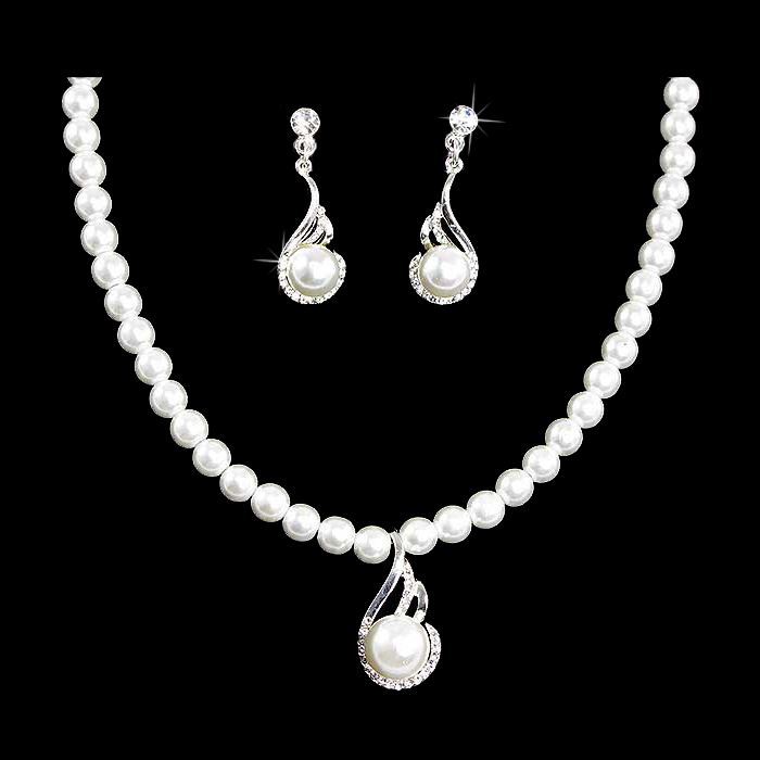 Bridal wedding jewelry set featuring a silver necklace with clear Austrian crystals and white faux pearls, accompanied by matching earrings.