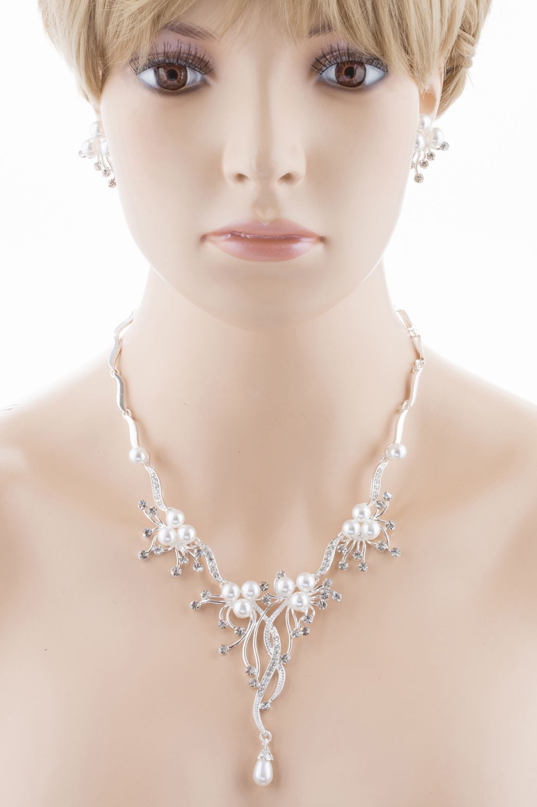 Bridal Wedding Jewelry Set featuring crystal rhinestones and faux pearls in a floral vine design, including a necklace and matching earrings.