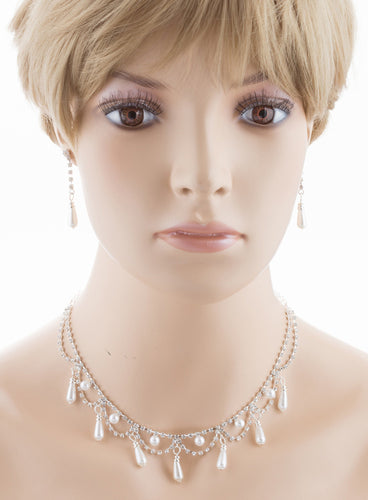 Bridal Wedding Jewelry Set featuring crystal rhinestones and pearls, including a 15-inch necklace with extension and 1.5-inch dangle earrings.