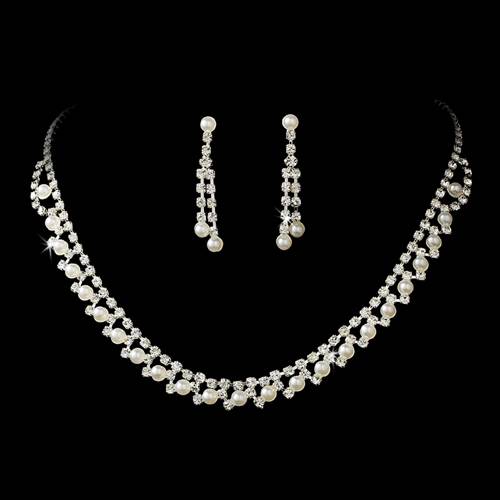 Bridal Wedding Jewelry Set featuring crystal rhinestones and faux pearls, including a necklace and matching earrings in silver plating.