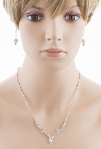 Bridal Wedding Jewelry Set featuring a silver necklace with clear crystal rhinestones and matching drop earrings, elegantly displayed.