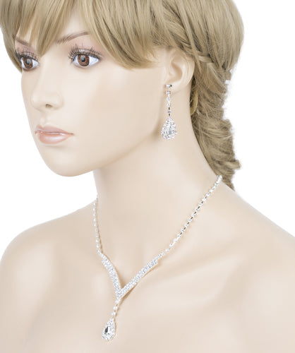 Bridal Wedding Jewelry Set featuring a silver necklace and matching earrings adorned with clear crystal rhinestones in a V-drop design.