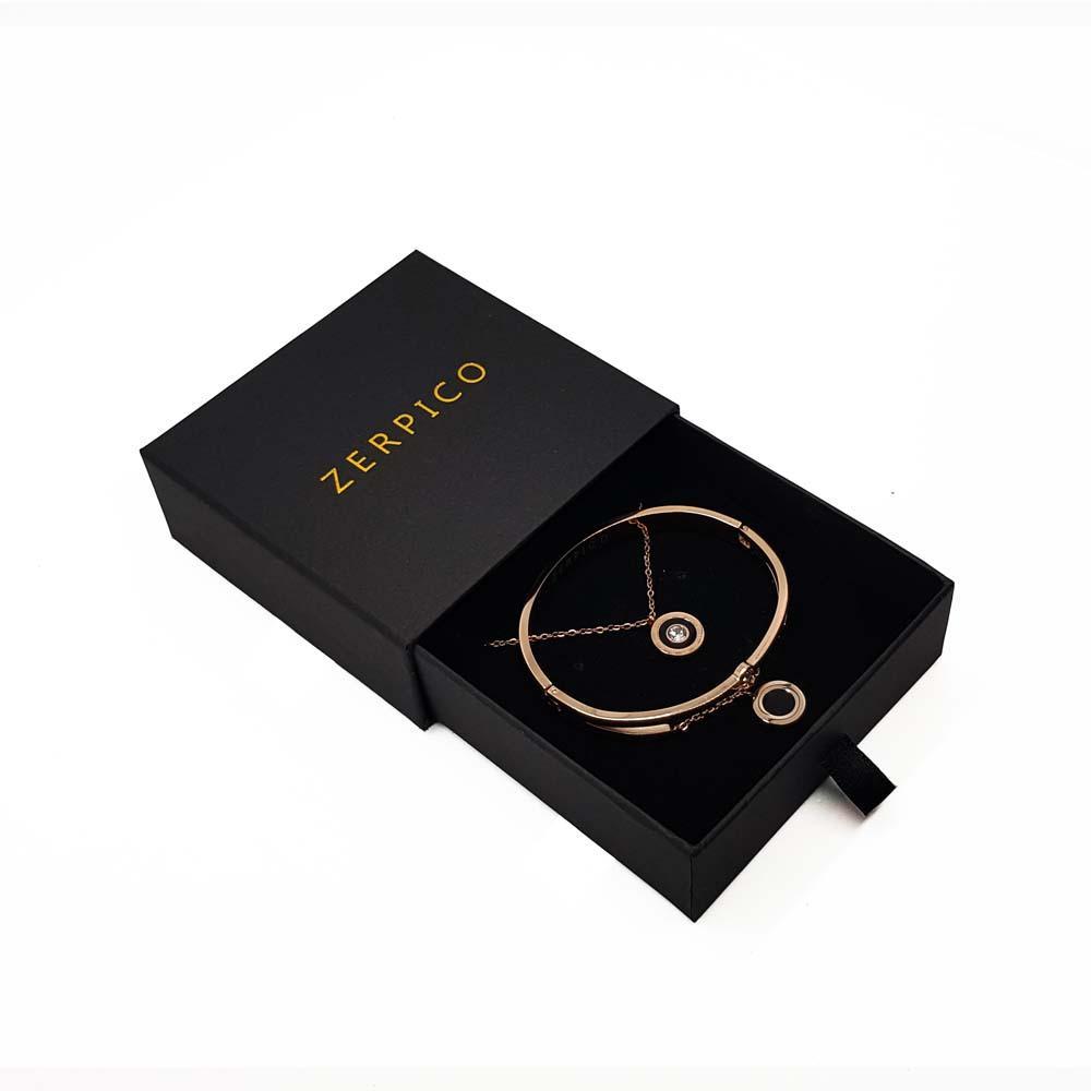 Gold bracelet in black box.