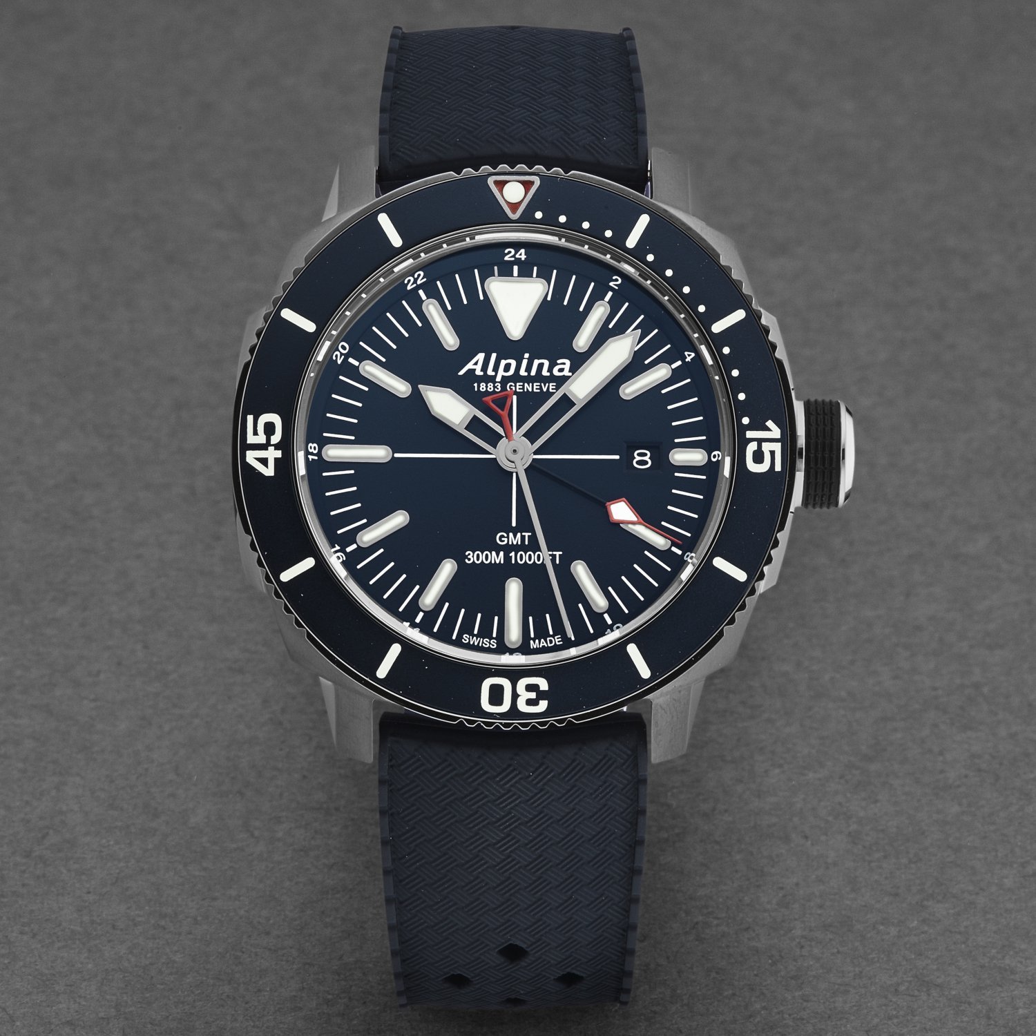 Alpina AL247LNN4TV6 Men's 'Seastrong Diver' GMT watch featuring a blue dial and blue rubber band, ideal for water sports.