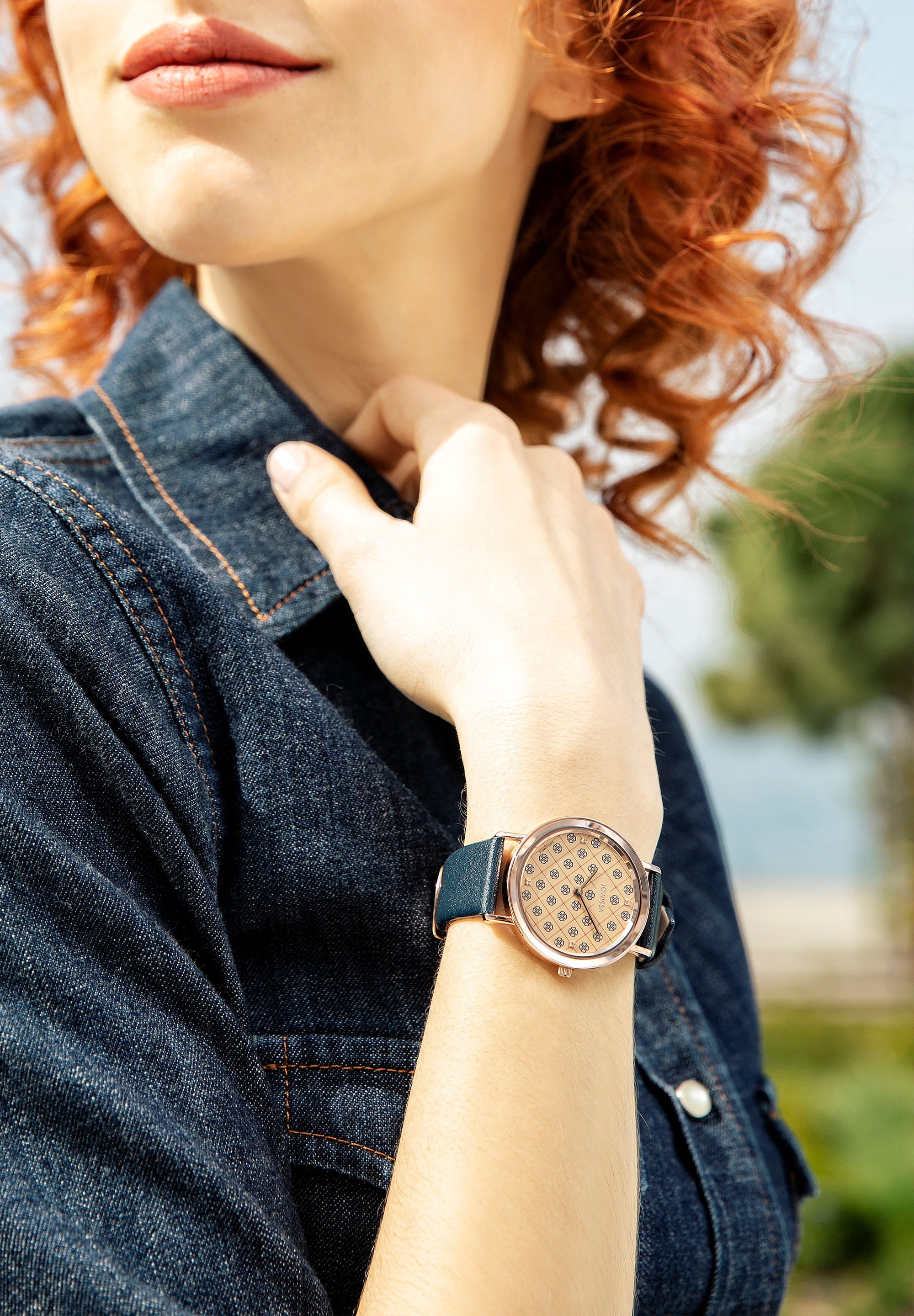 AnWy Swiss Ladies Watch J6.223.L featuring a gold-beige dial with navy logo pattern, stainless steel case, and genuine leather strap.