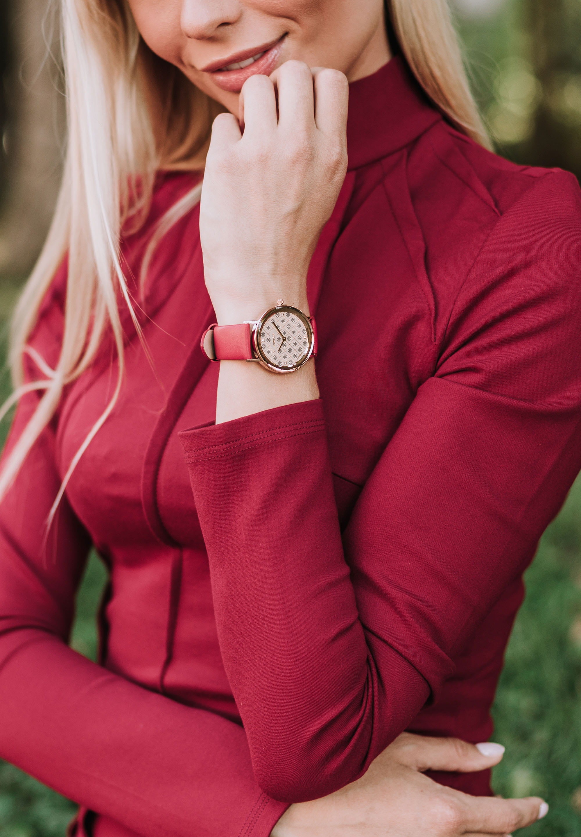 AnWy Swiss Ladies Watch J6.224.L featuring a red leather strap, golden-beige dial with logo pattern, and rose-gold stainless steel case.