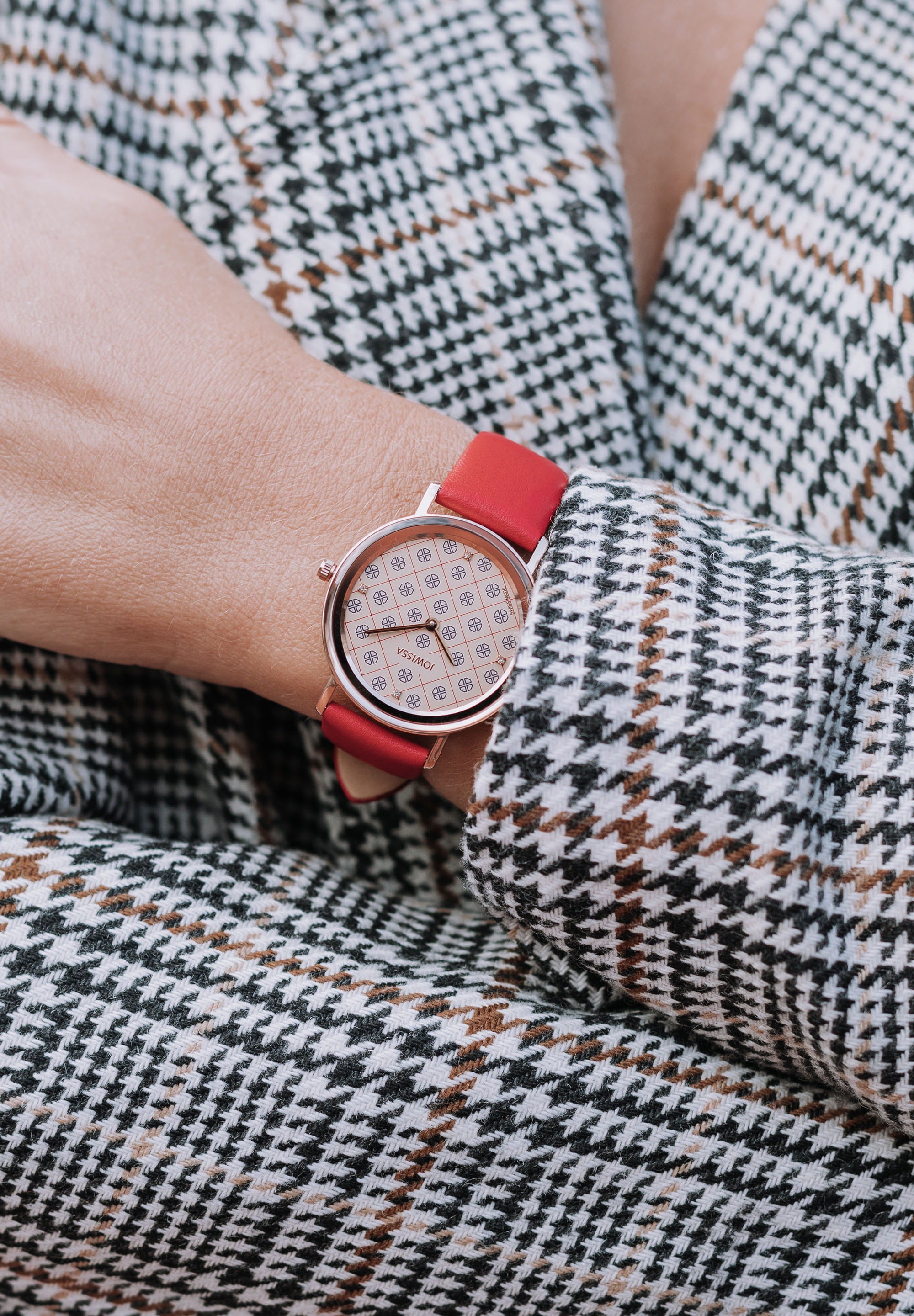 AnWy Swiss Ladies Watch J6.224.L featuring a red leather strap, golden-beige dial with logo pattern, and rose-gold stainless steel case.