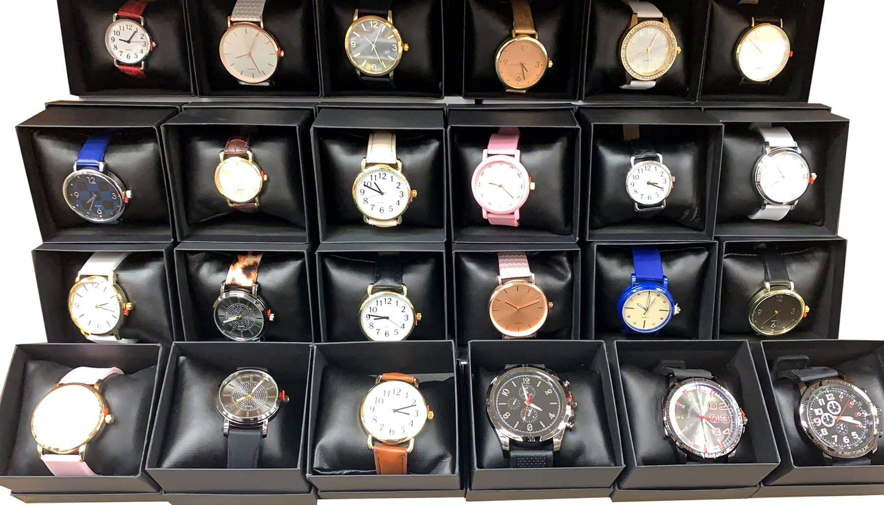 A collection of 24 assorted women's watches displayed in an elegant gift box, showcasing various styles and colors.