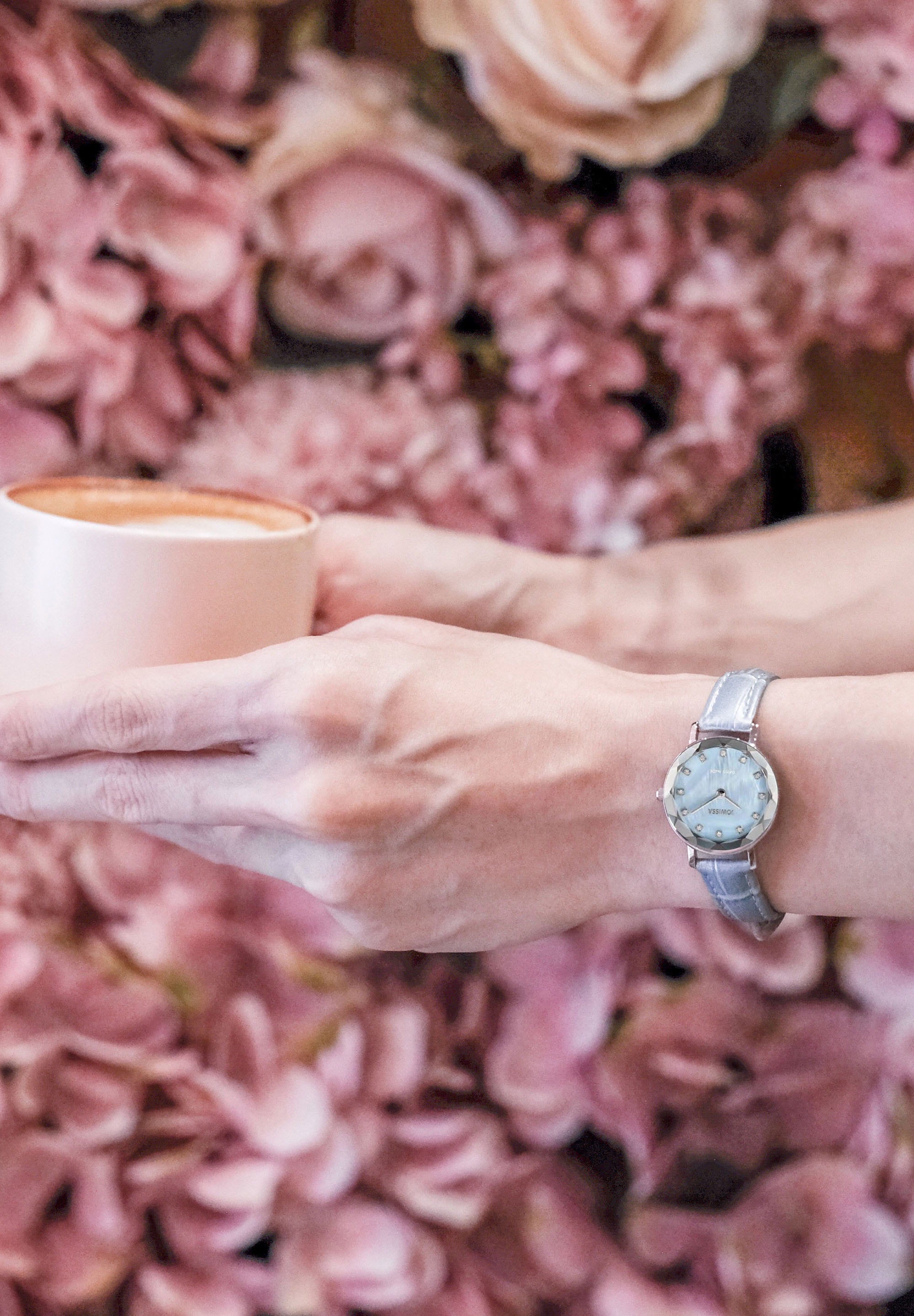 Aura Swiss Ladies Watch J5.642.S with blue mother-of-pearl dial and silver stainless steel case, featuring rhinestones and alligator leather strap.