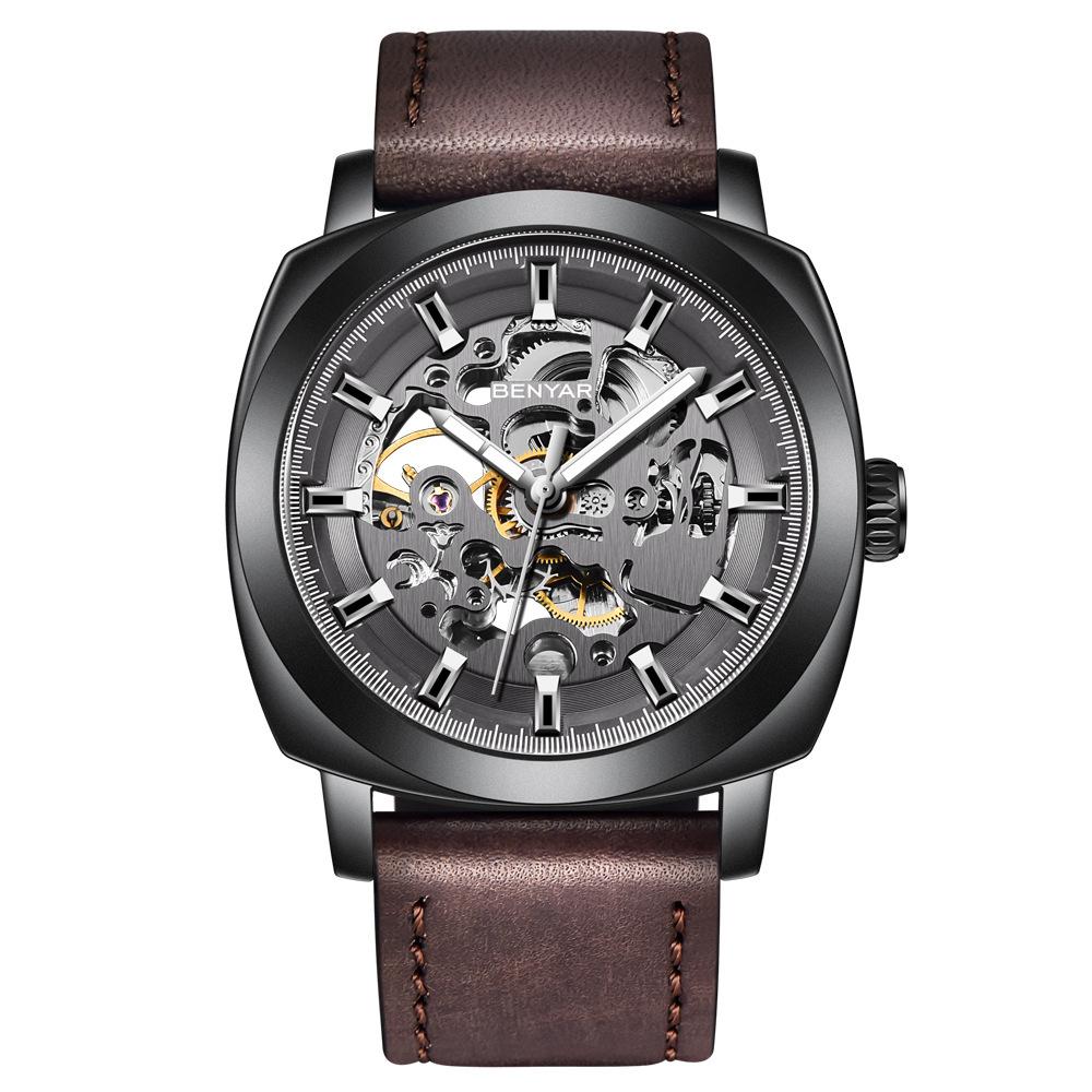 Casual Business Hollow Mechanical Watch for Men featuring a zinc alloy case and soft leather strap, showcasing its intricate mechanical design.