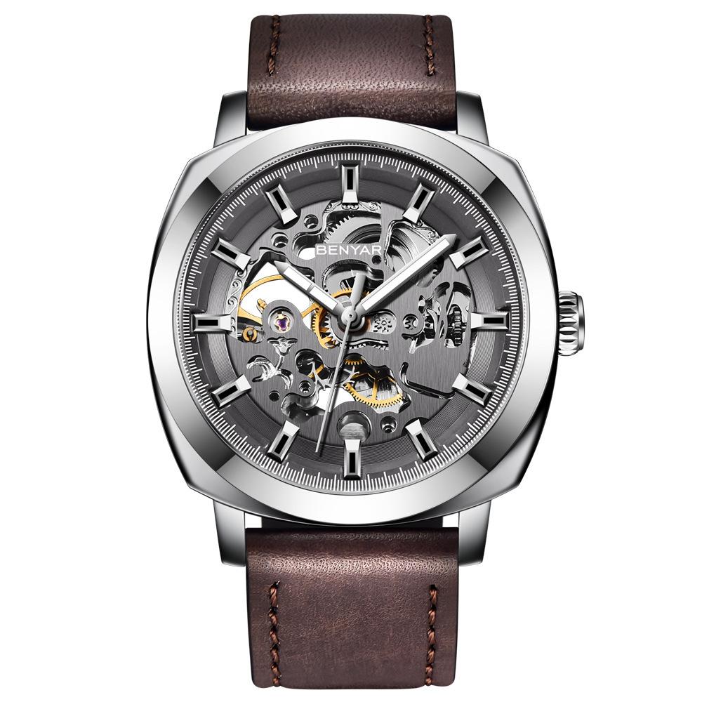 Casual Business Hollow Mechanical Watch for Men featuring a zinc alloy case and soft leather strap, showcasing its intricate mechanical design.