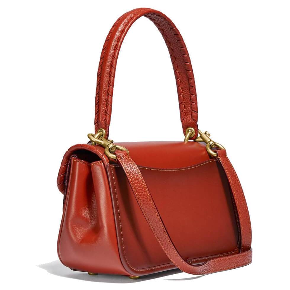 Coach Ladies Cody Leather Shoulder Bag in Tan Rust with whipstitch detailing, showcasing signature canvas and leather materials.