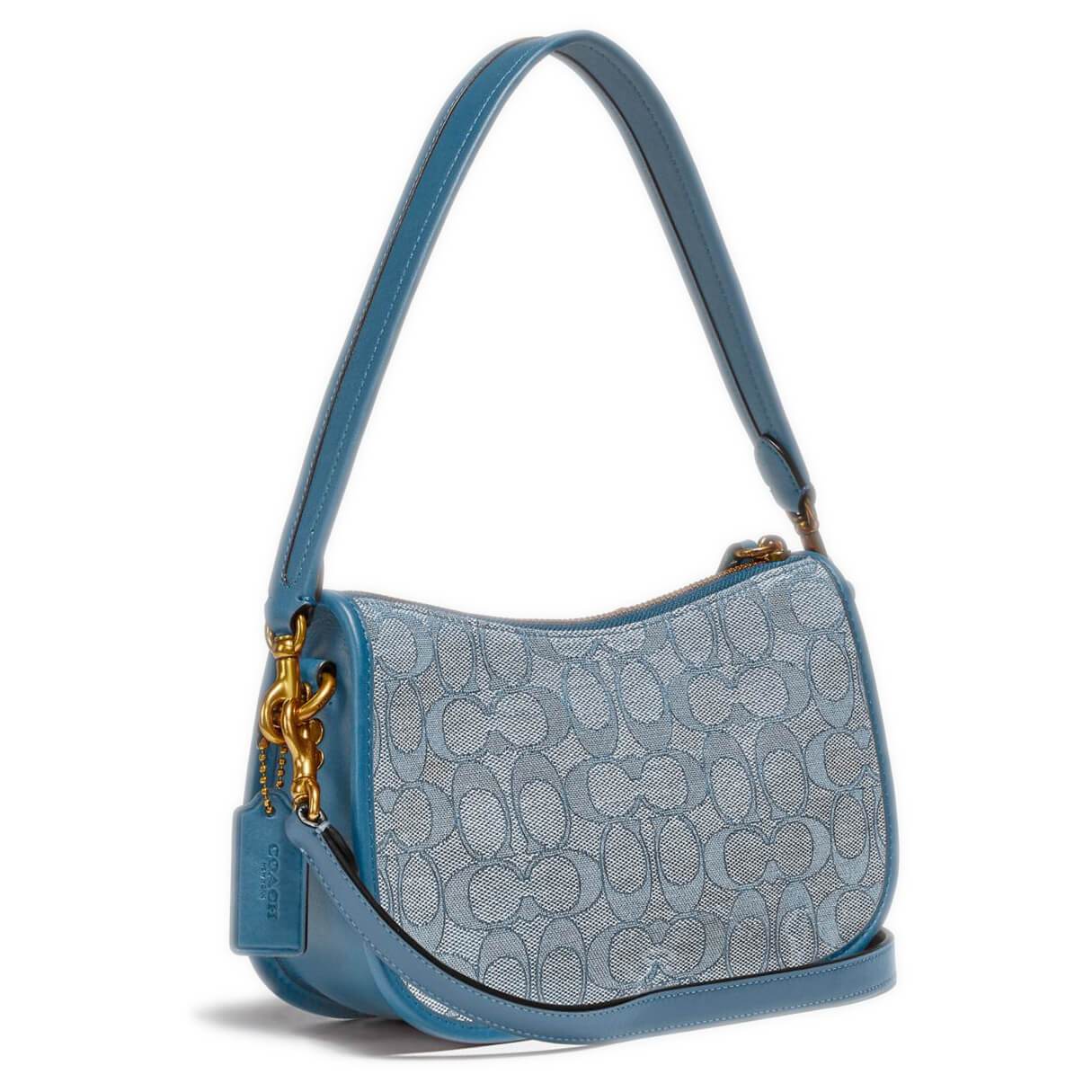 Coach Swinger Bag in Signature Jacquard featuring detachable straps and iconic turnlock closure, showcasing its stylish design.