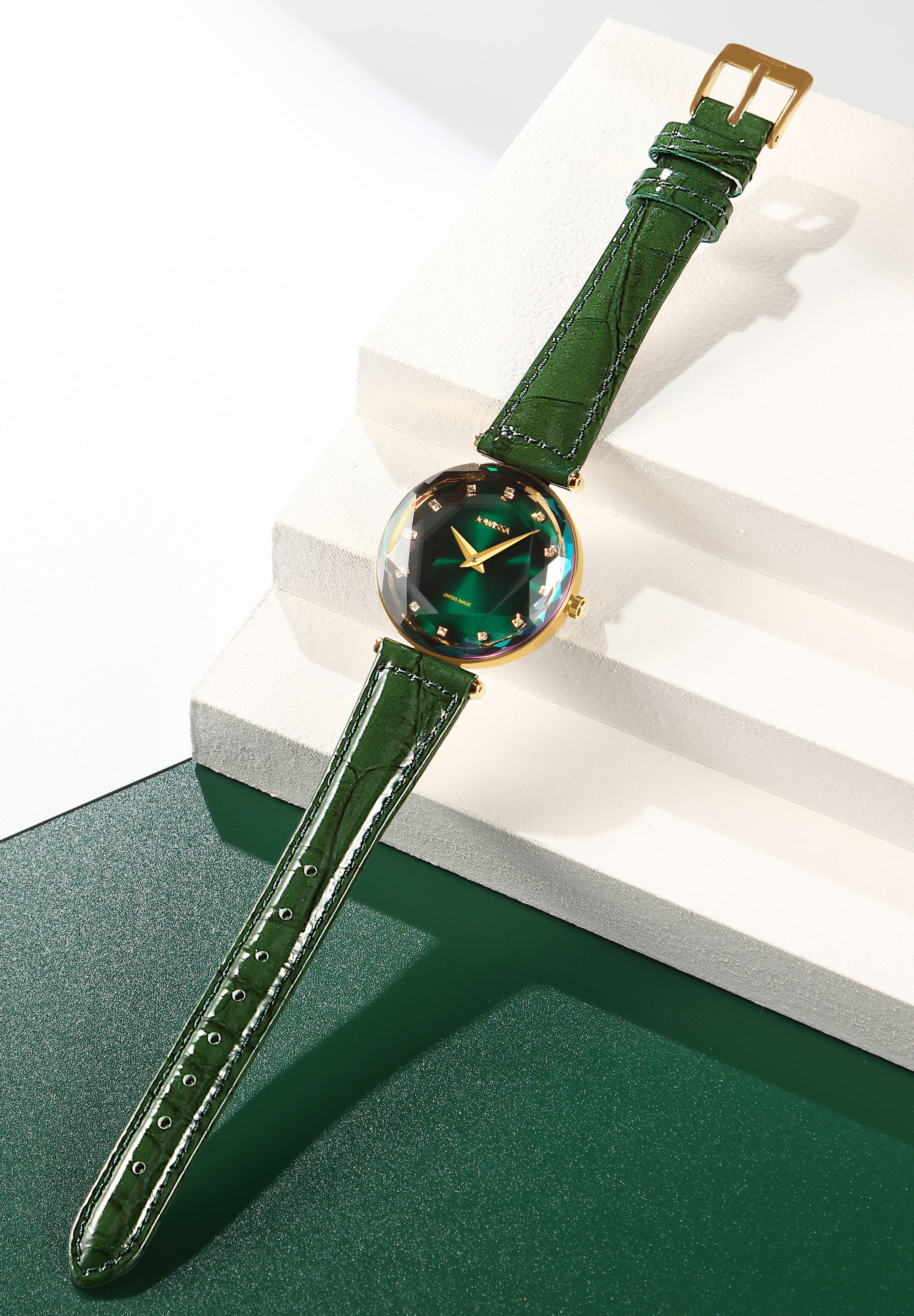 Facet Brilliant Swiss Ladies Watch J5.754.M featuring an emerald green dial, stainless steel case, and glossy leather strap.