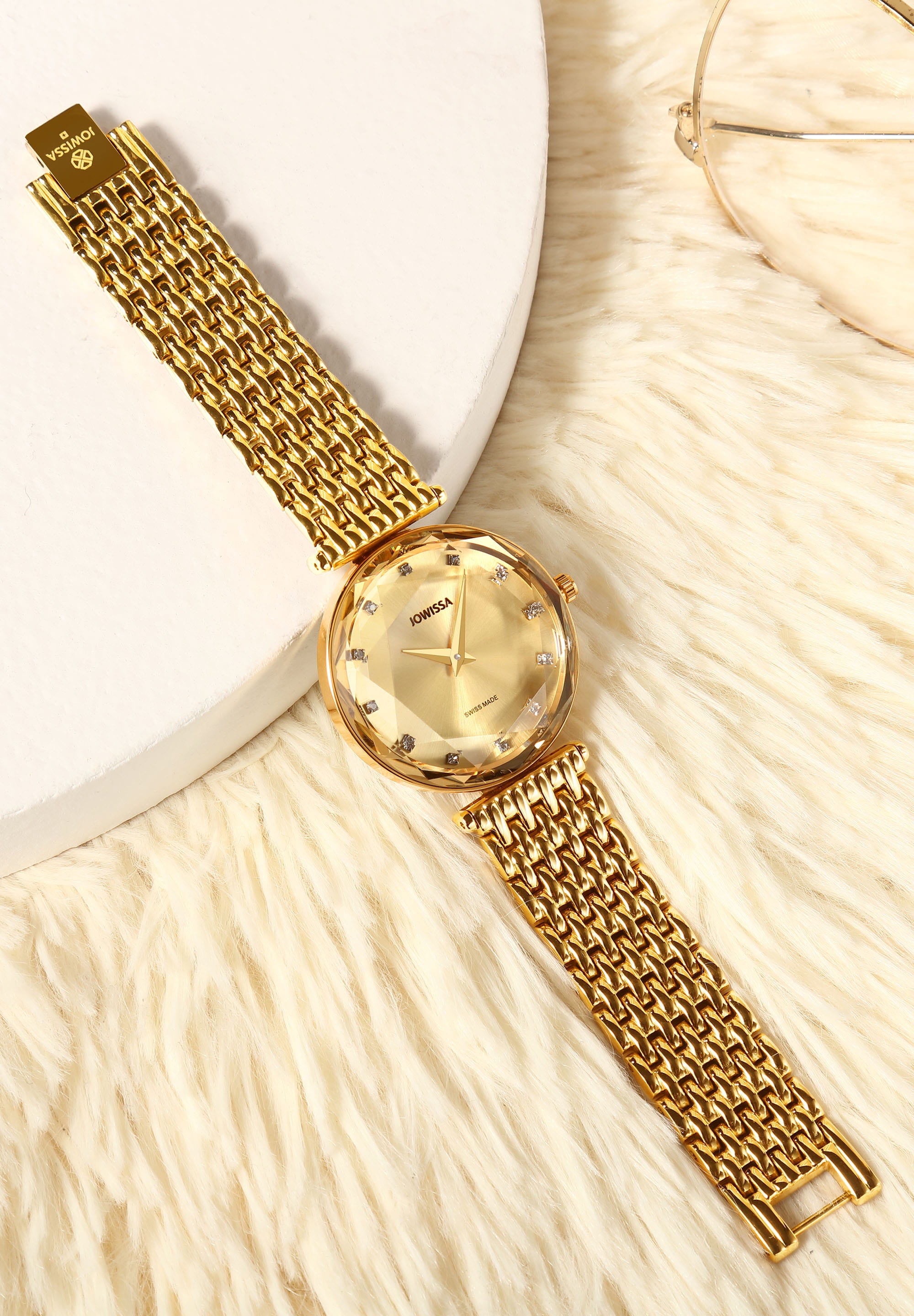 Facet Brilliant Swiss Ladies Watch J5.757.M featuring a champagne-colored dial, stainless steel case, and gold-tone bracelet.