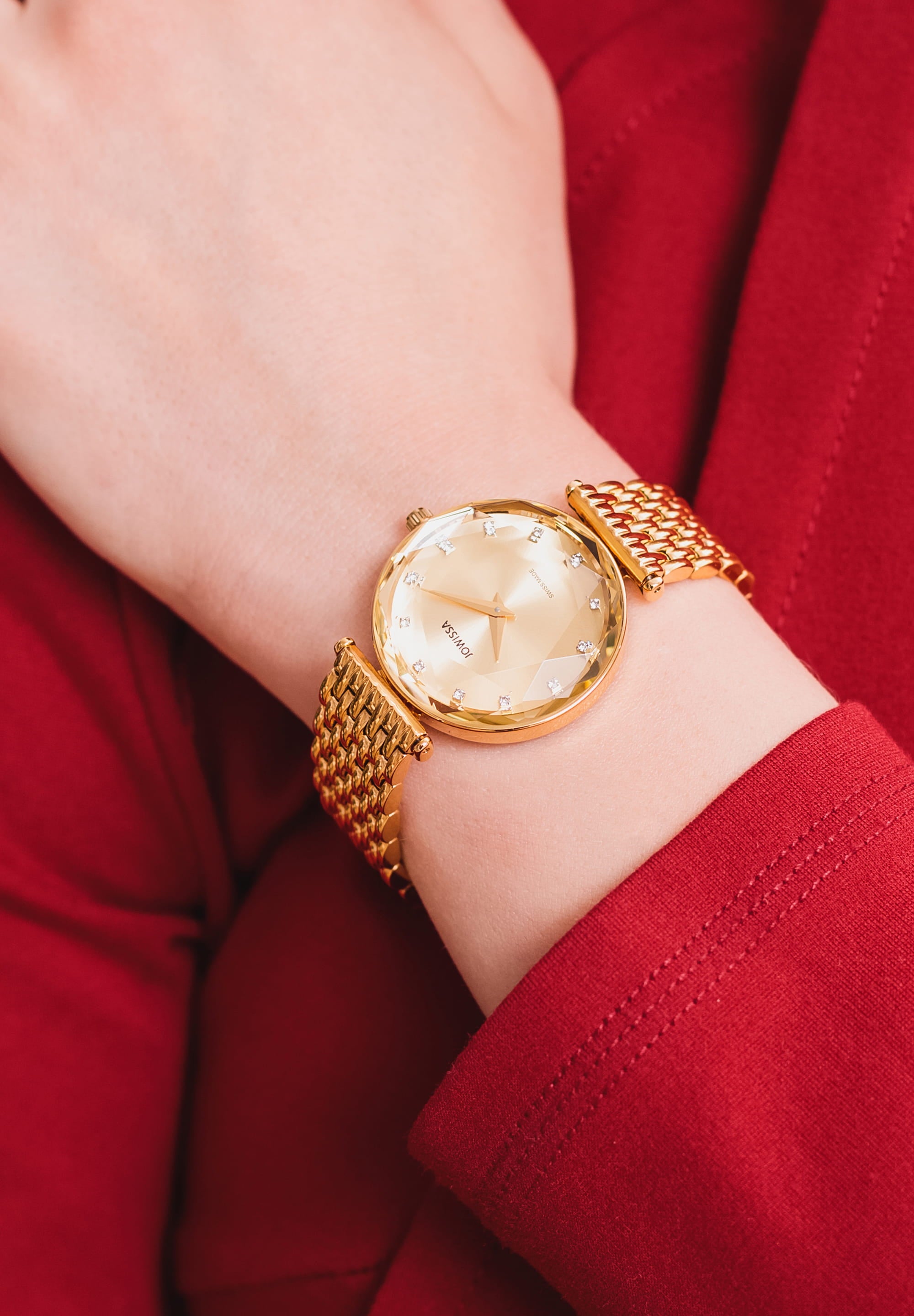 Facet Brilliant Swiss Ladies Watch J5.757.M featuring a champagne-colored dial, stainless steel case, and gold-tone bracelet.