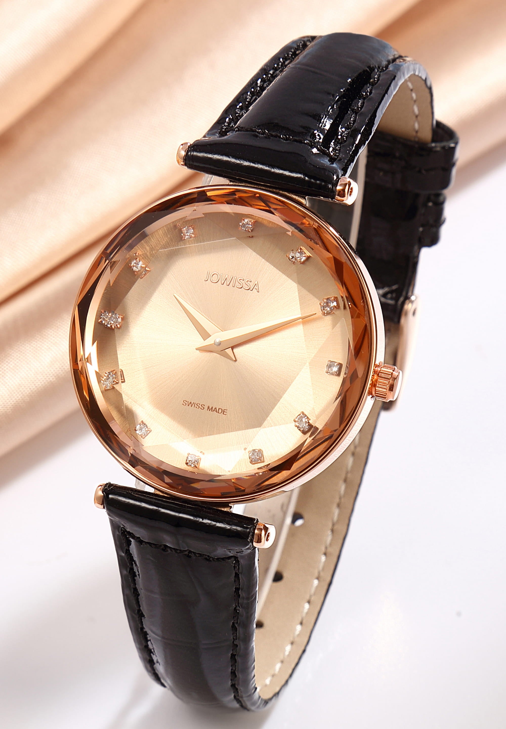 Facet Brilliant Swiss Ladies Watch J5.833.M featuring a rose gold case and black leather strap, showcasing a shiny sunray dial with rhinestone hour indices.