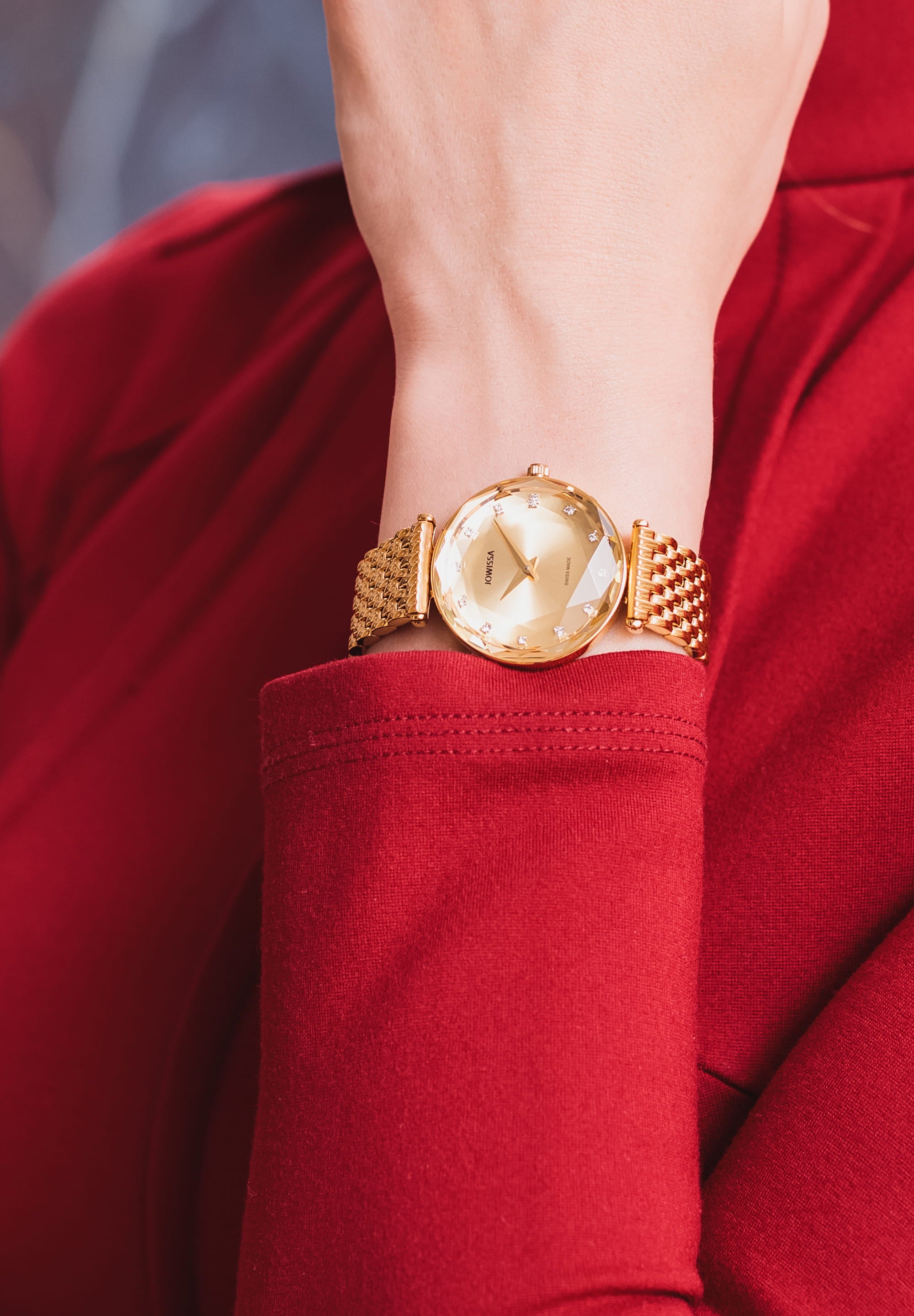 Facet Brilliant Swiss Ladies Watch J5.841.M featuring a luxurious champagne gold finish, sparkling cubic zirconia, and a stainless steel bracelet.