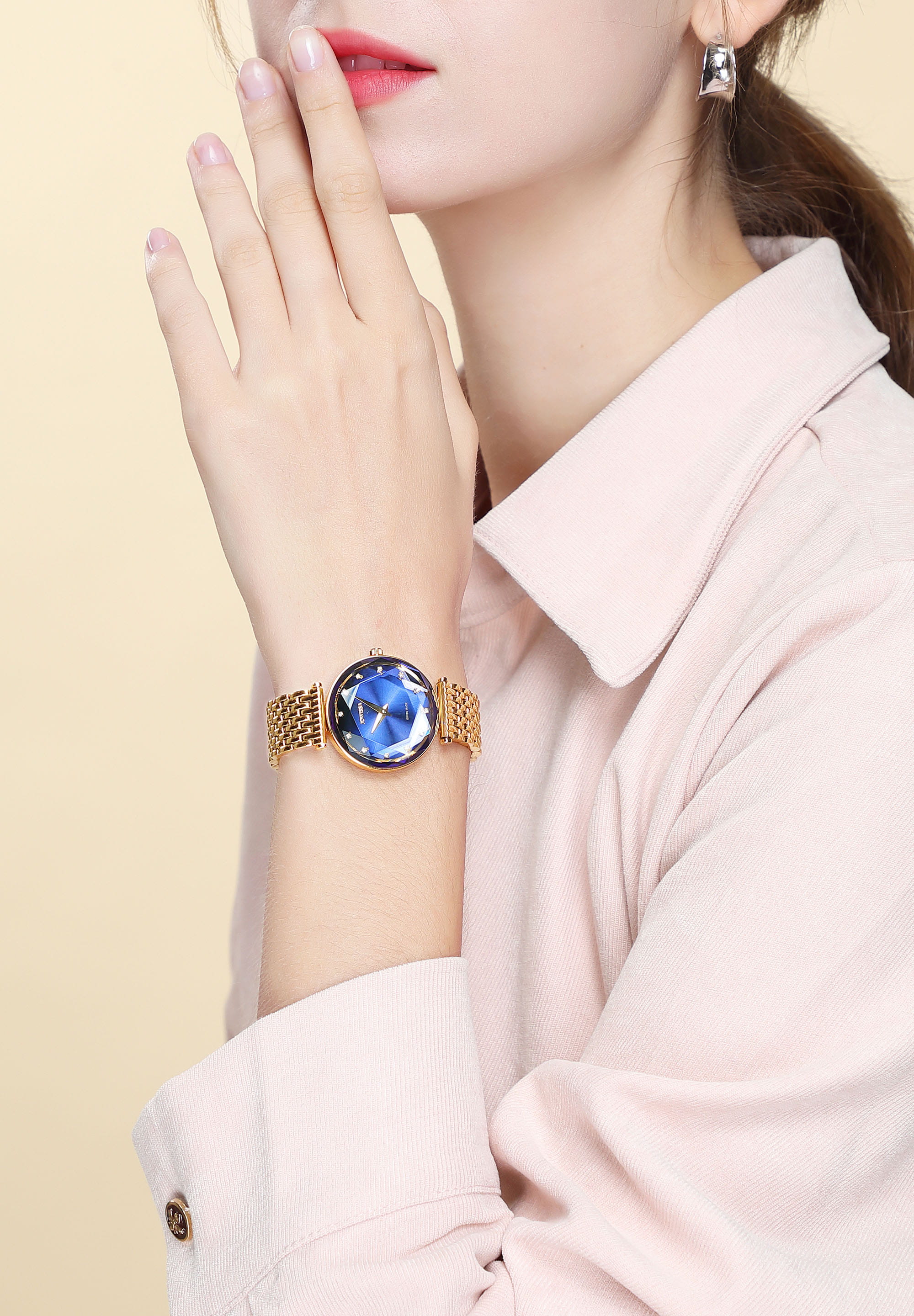 Facet Brilliant Swiss Ladies Watch J5.842.M featuring a blue dial, gold stainless steel bracelet, and sparkling mineral glass.