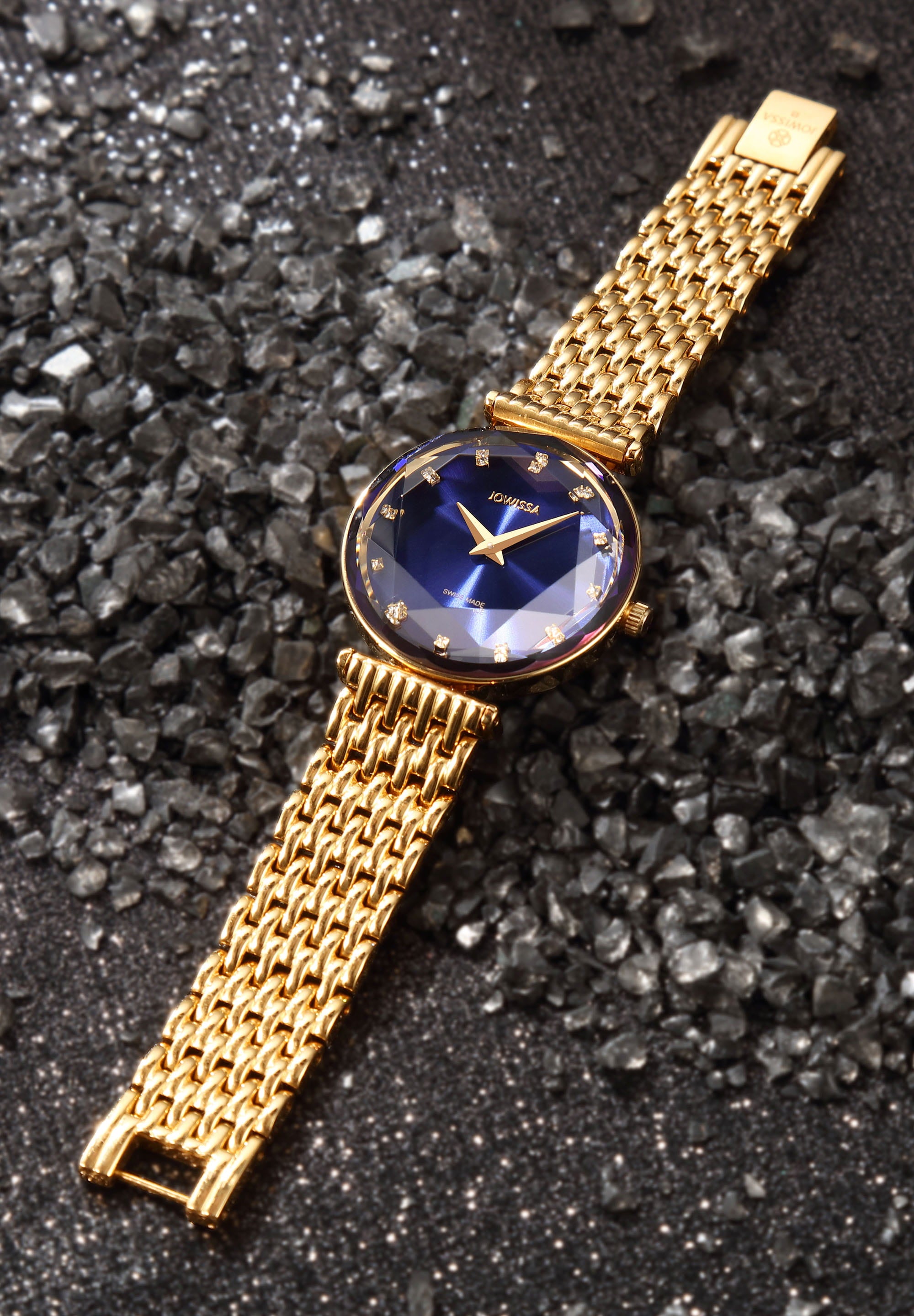 Facet Brilliant Swiss Ladies Watch J5.842.M featuring a blue dial, gold stainless steel bracelet, and sparkling mineral glass.