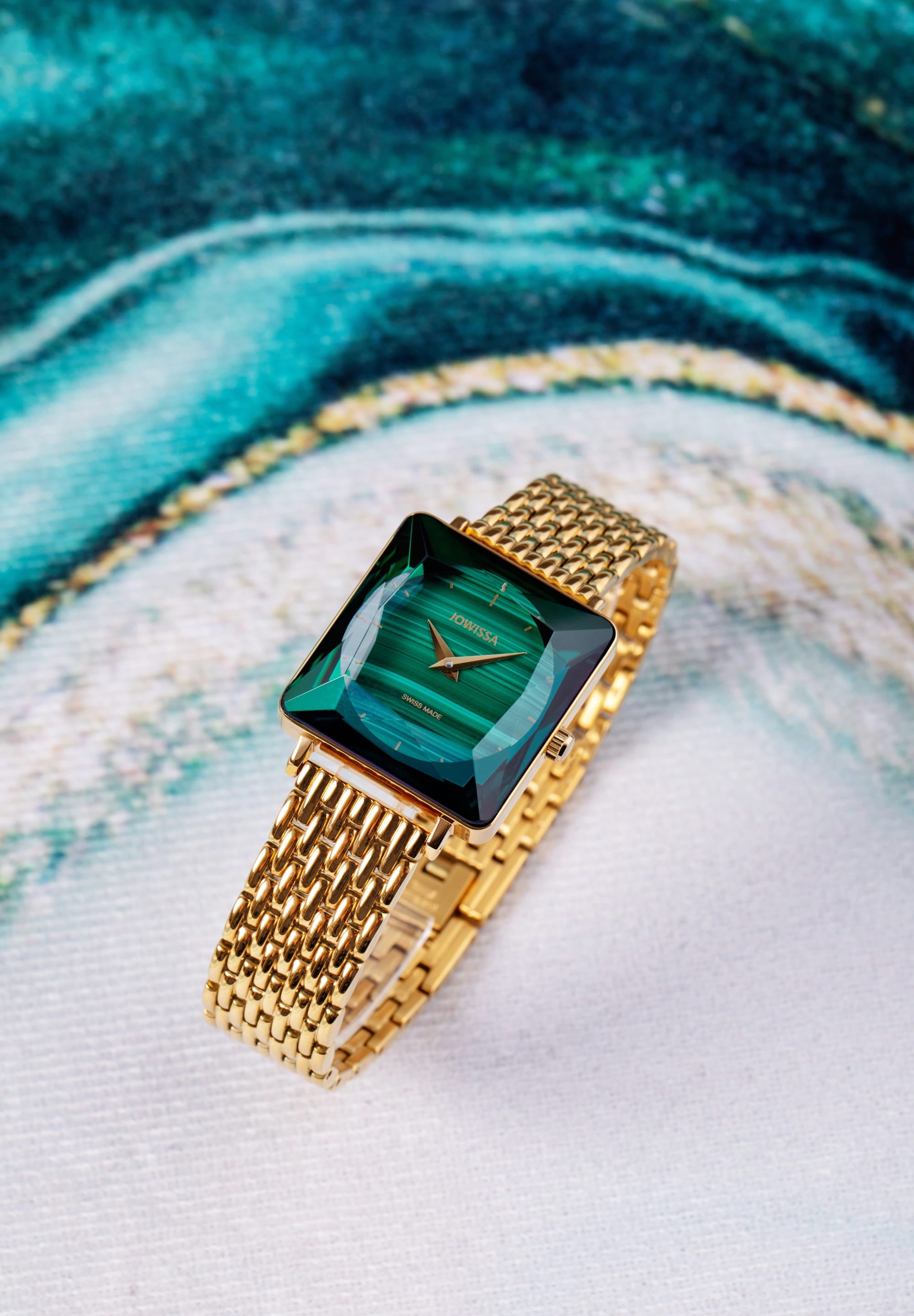 Facet Princess Swiss Ladies Watch J8.774.M featuring a malachite dial and gold-tone bracelet, showcasing elegance and luxury.