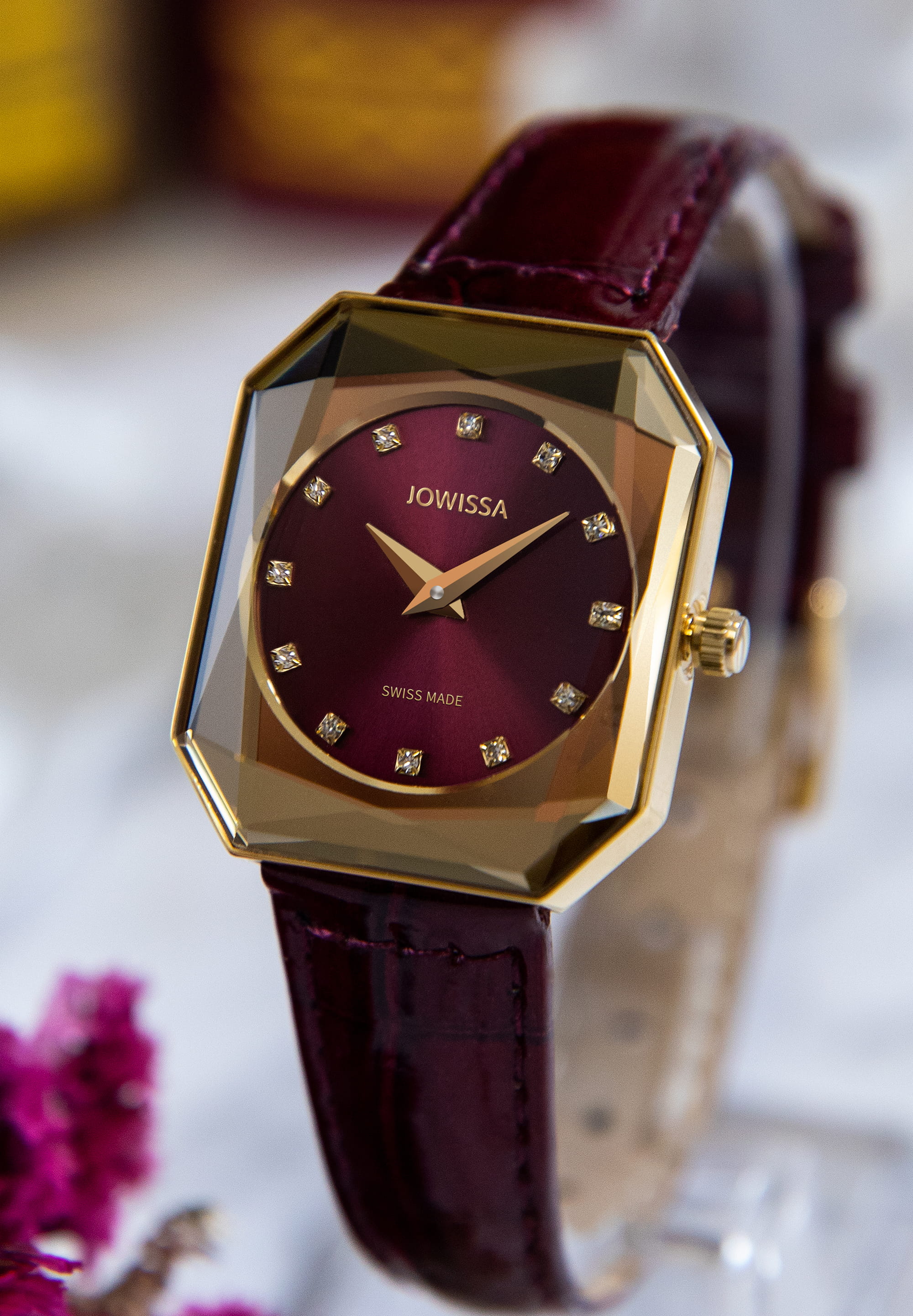 Facet Radiant Swiss Ladies Watch J8.076.M featuring a gold case, burgundy dial, and glossy leather strap, showcasing elegance and luxury.