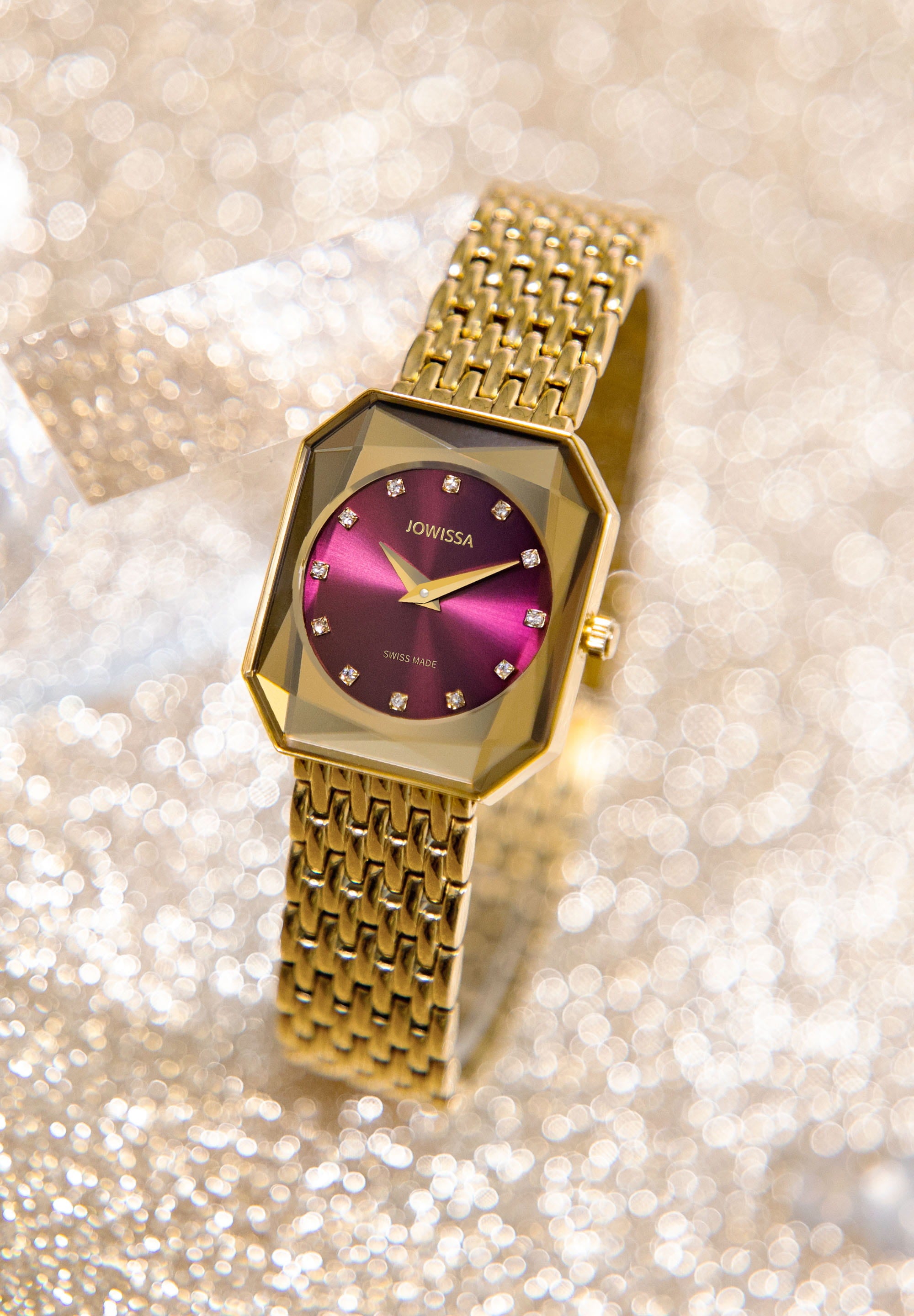 Facet Radiant Swiss Ladies Watch J8.082.M featuring a gold case and red dial with rhinestones.