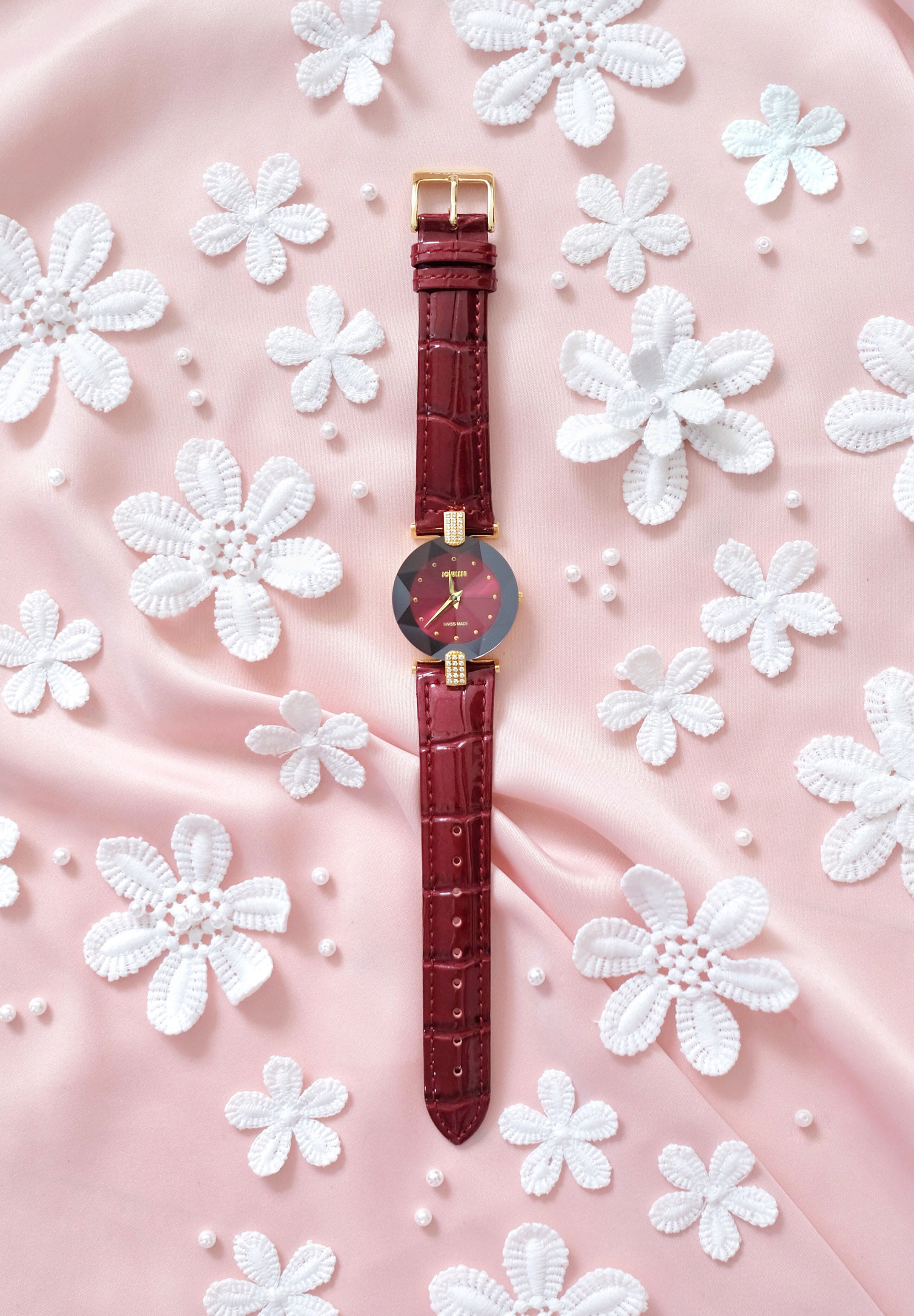 Facet Strass Swiss Ladies Watch J5.013.M featuring a stainless steel case with rhinestones, a glossy alligator-embossed leather strap, and a sunray dial.