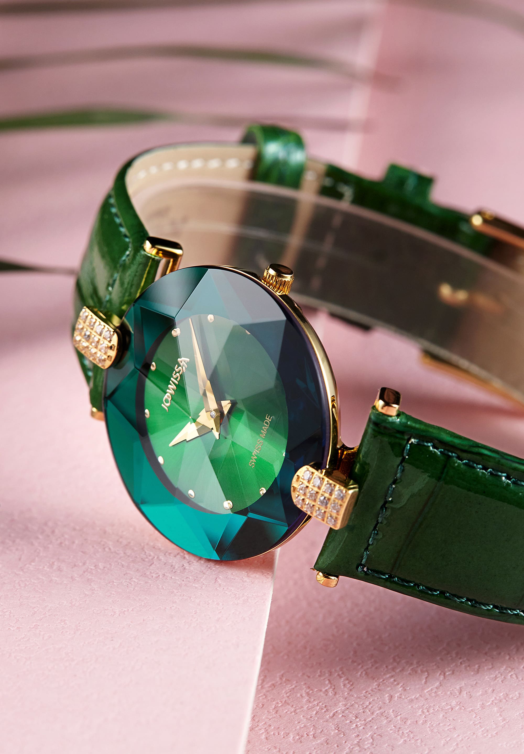 Facet Strass Swiss Ladies Watch J5.244.M featuring a stainless steel case, rhinestone embellishments, and a green alligator-embossed leather strap.