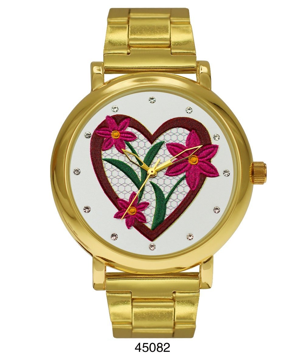 M Milano Expressions Hallandale Beach gold metal band watch featuring a heart and flower dial design.