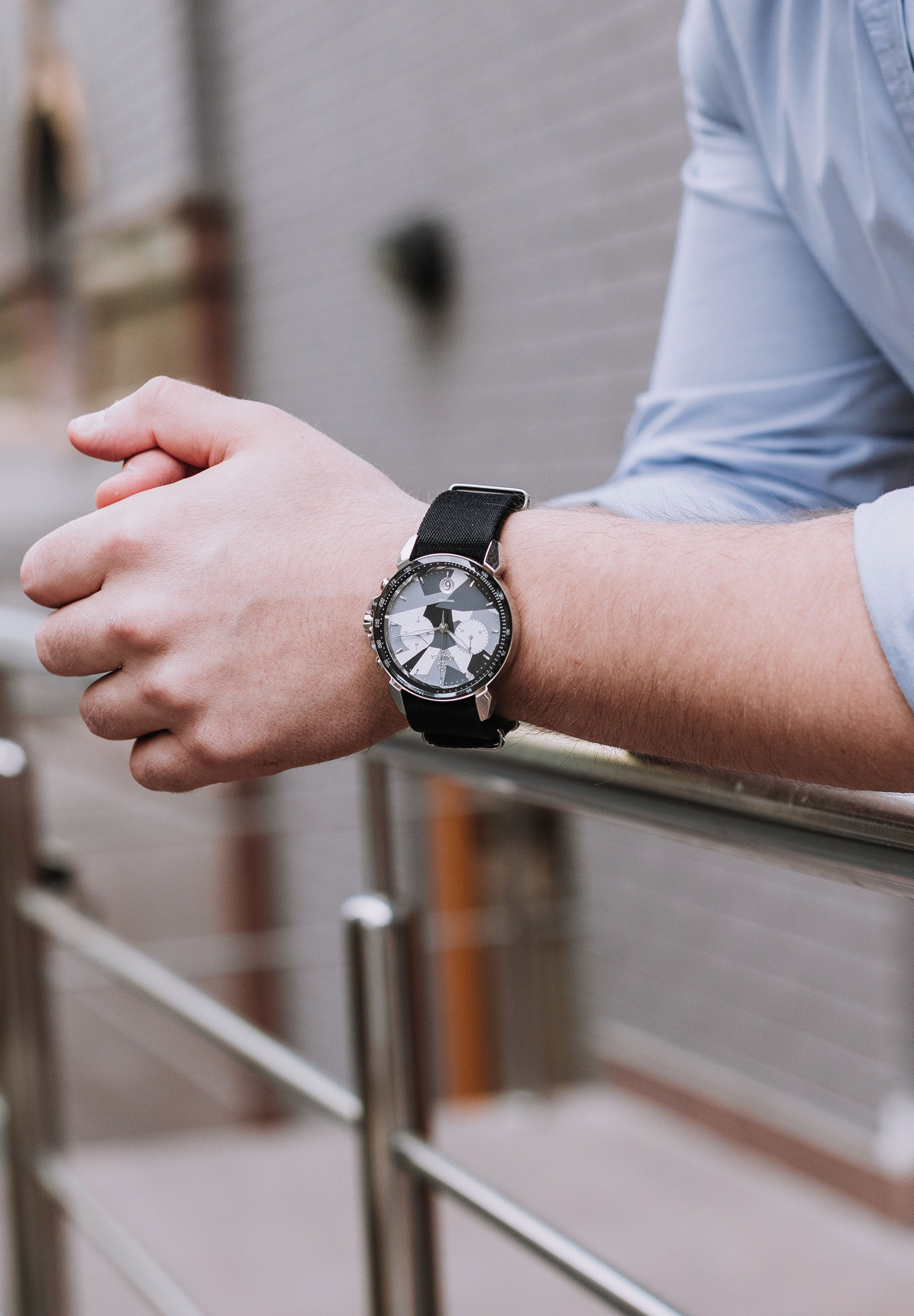 LeWy 15 Swiss Men's Watch J7.131.L featuring a camouflage dial, stainless steel case, and black NATO strap.