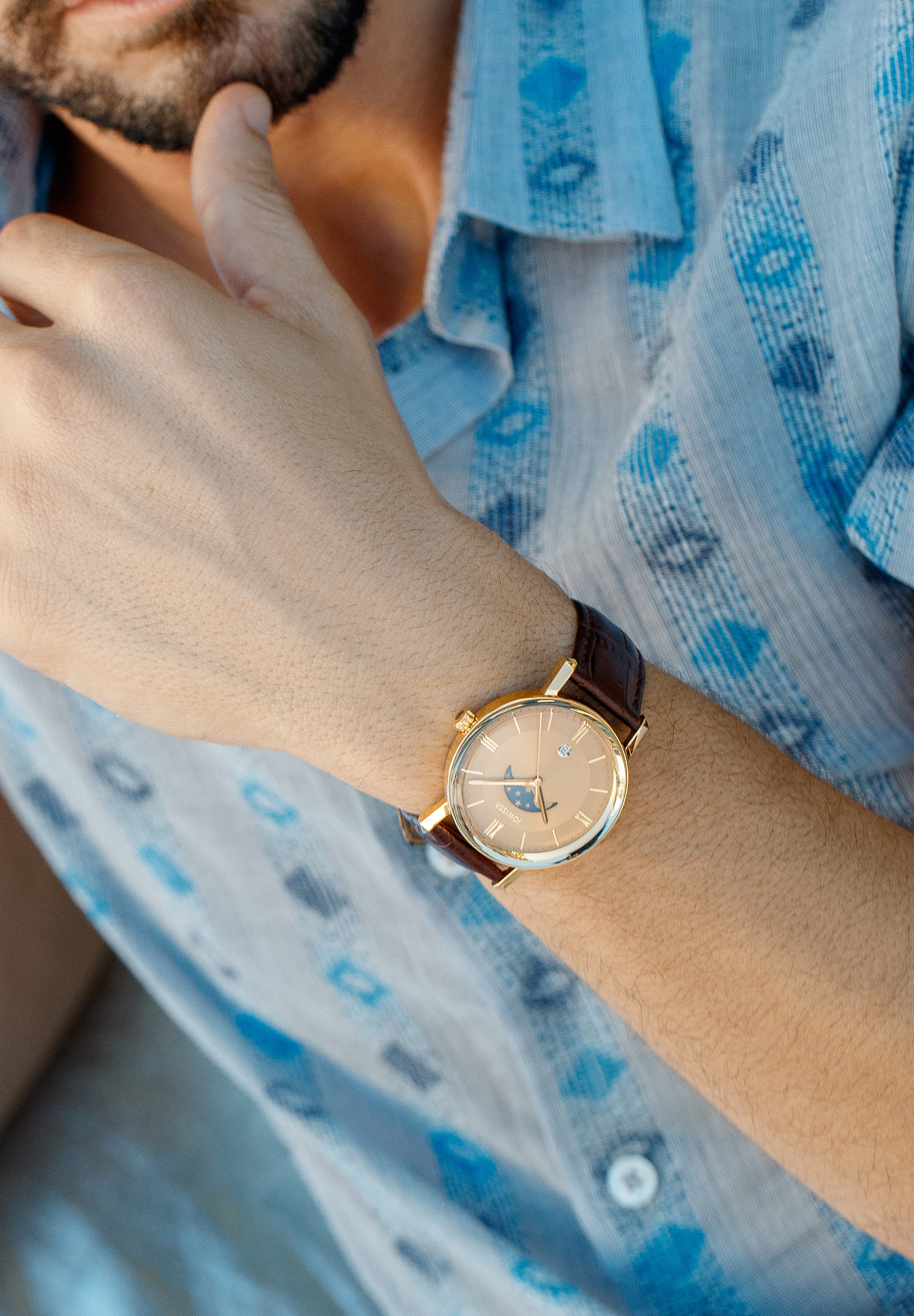 Magno Swiss Men's Watch J4.274.L featuring a gold dial, blue moon phase display, and brown alligator-embossed leather strap.