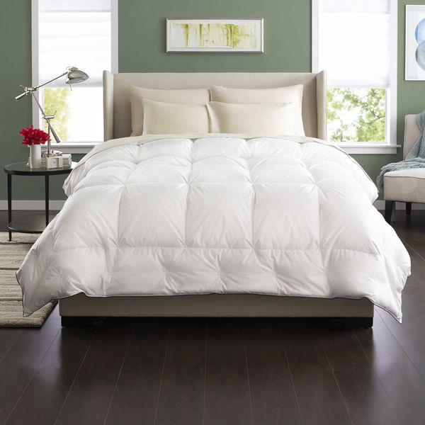 Bed with white comforter.