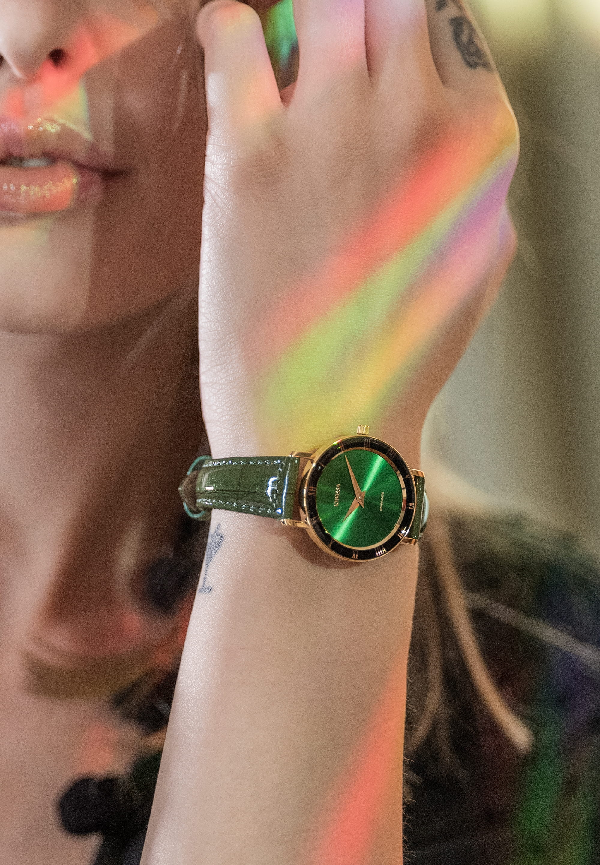 Roma Swiss Ladies Watch J2.273.M featuring an emerald-green dial, gold-tone Roman numerals, and a glossy green leather strap.