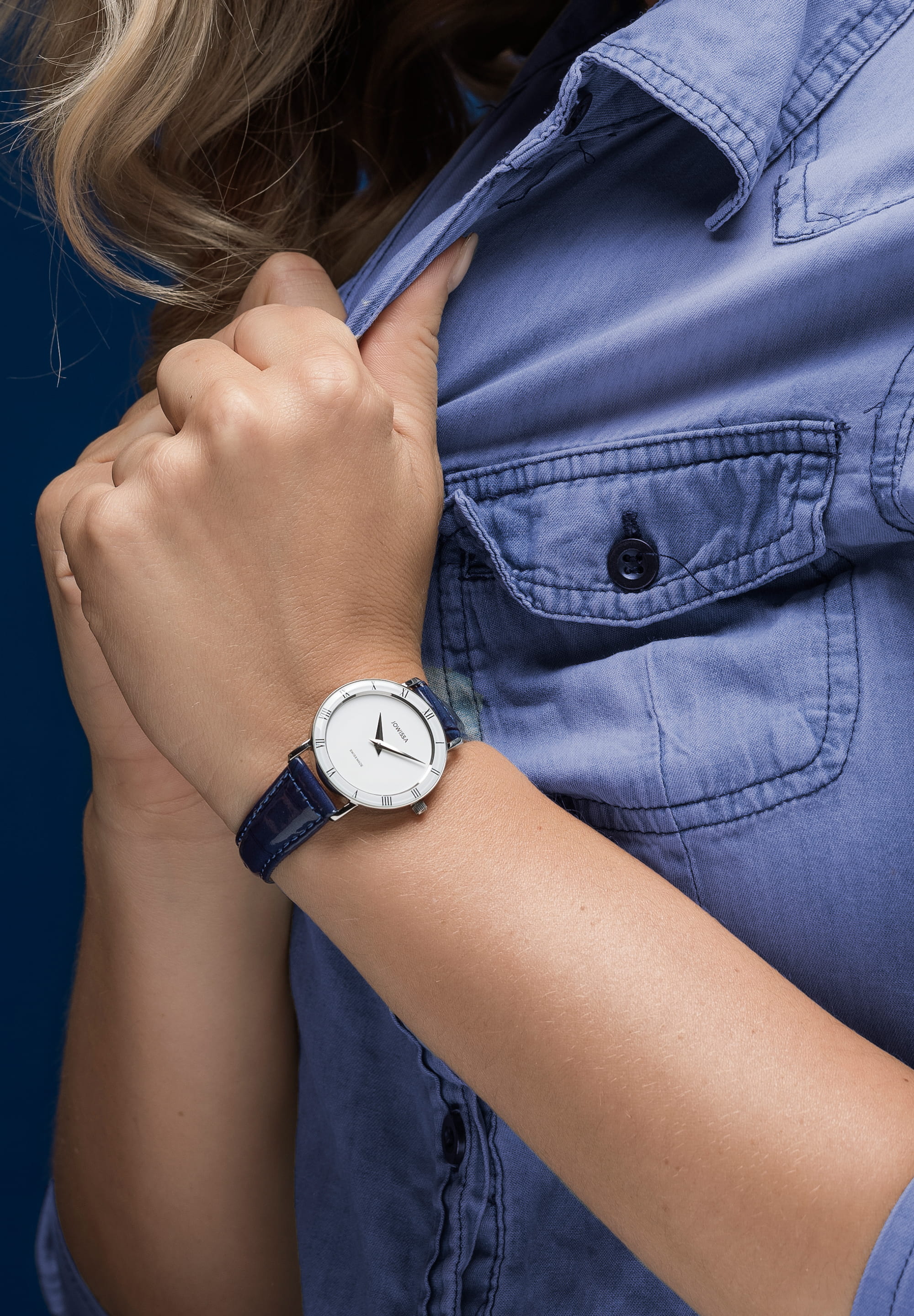 Roma Swiss Ladies Watch J2.275.M featuring a blue leather strap, white dial, and Roman numerals, showcasing elegant Swiss craftsmanship.