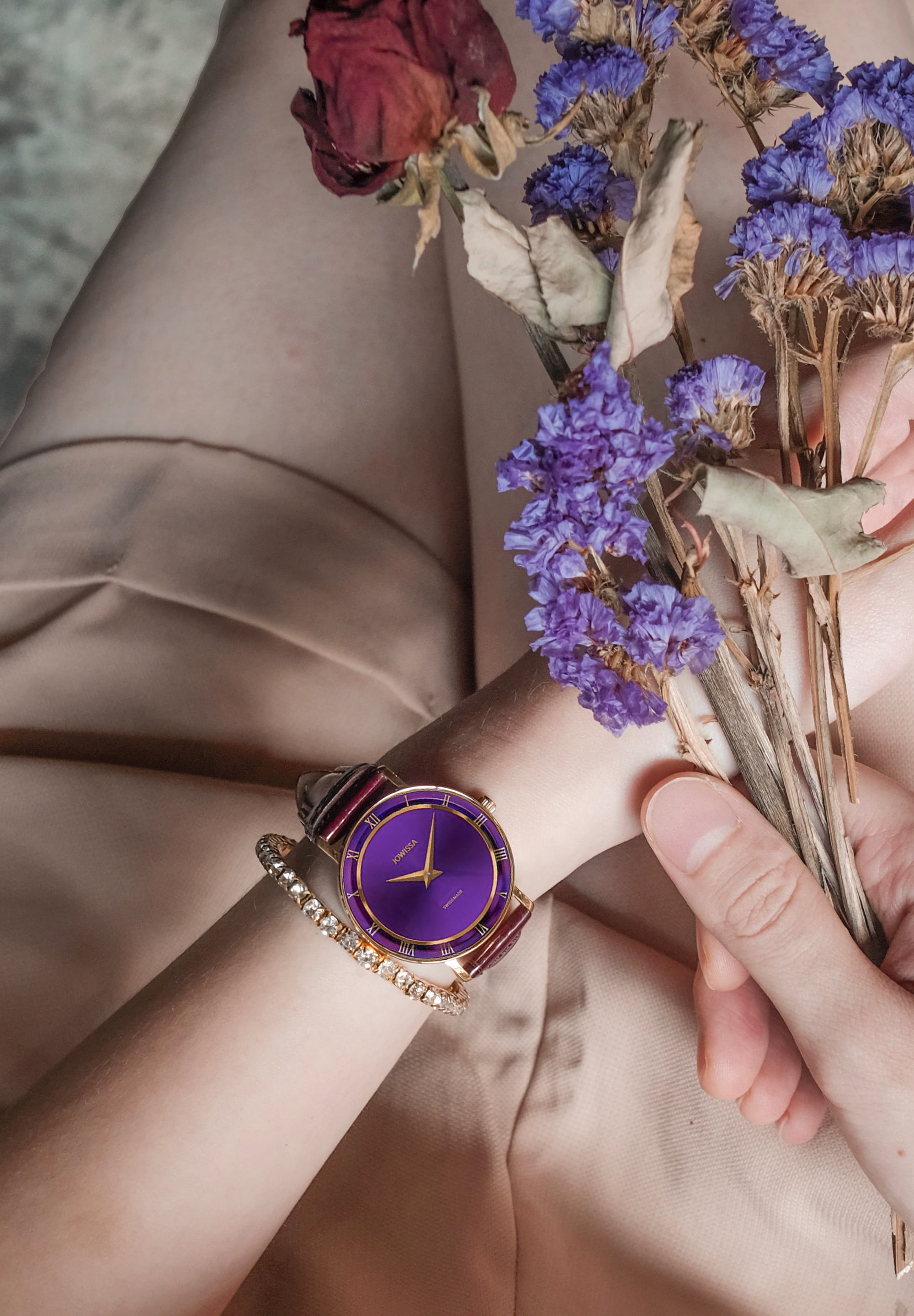 Roma Swiss Ladies Watch J2.293.M featuring a purple dial, gold-tone hands, and a glossy leather strap.