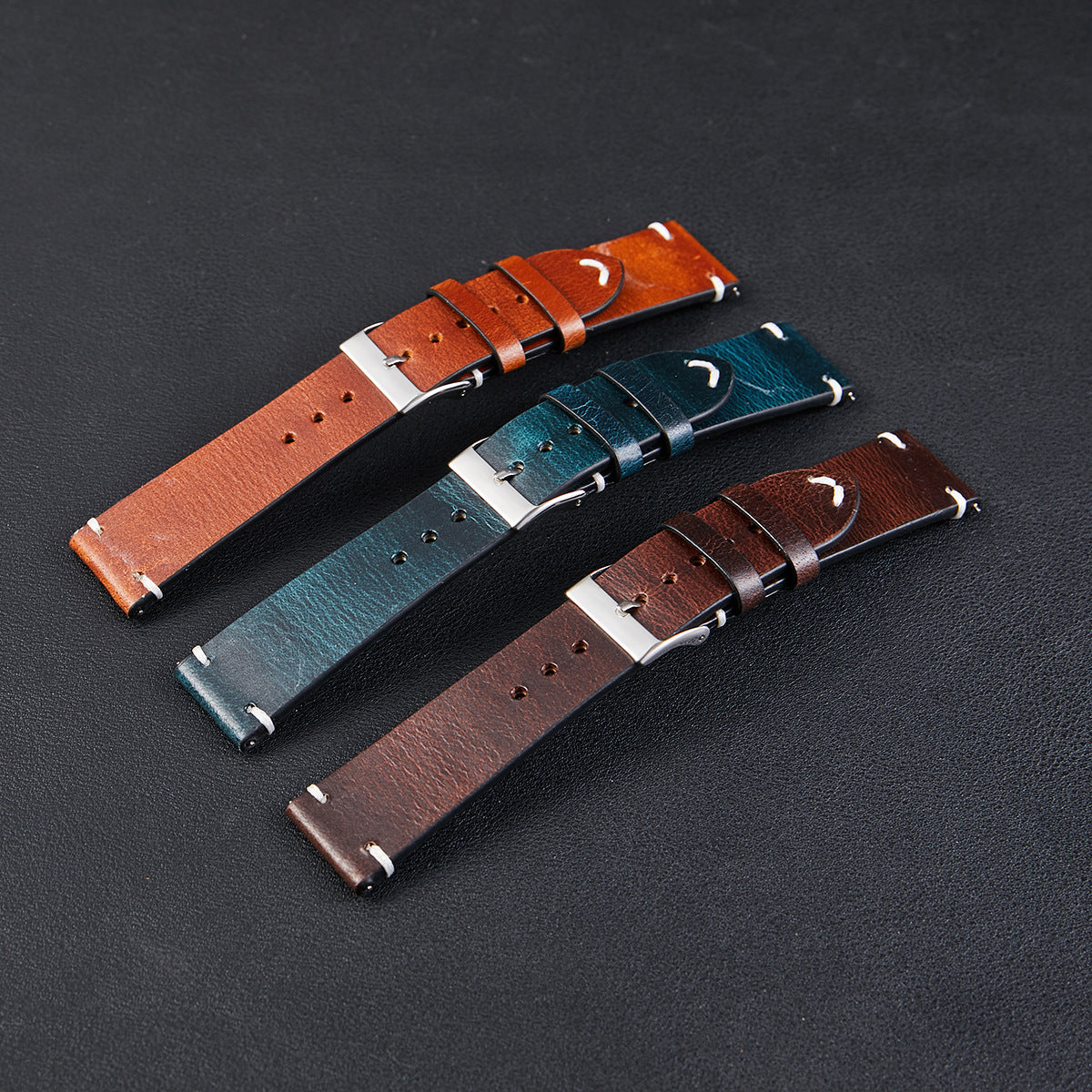 Six-color retro oil wax leather watch strap showcasing its unique discoloration and quick-release design, made from premium Italian cowhide.