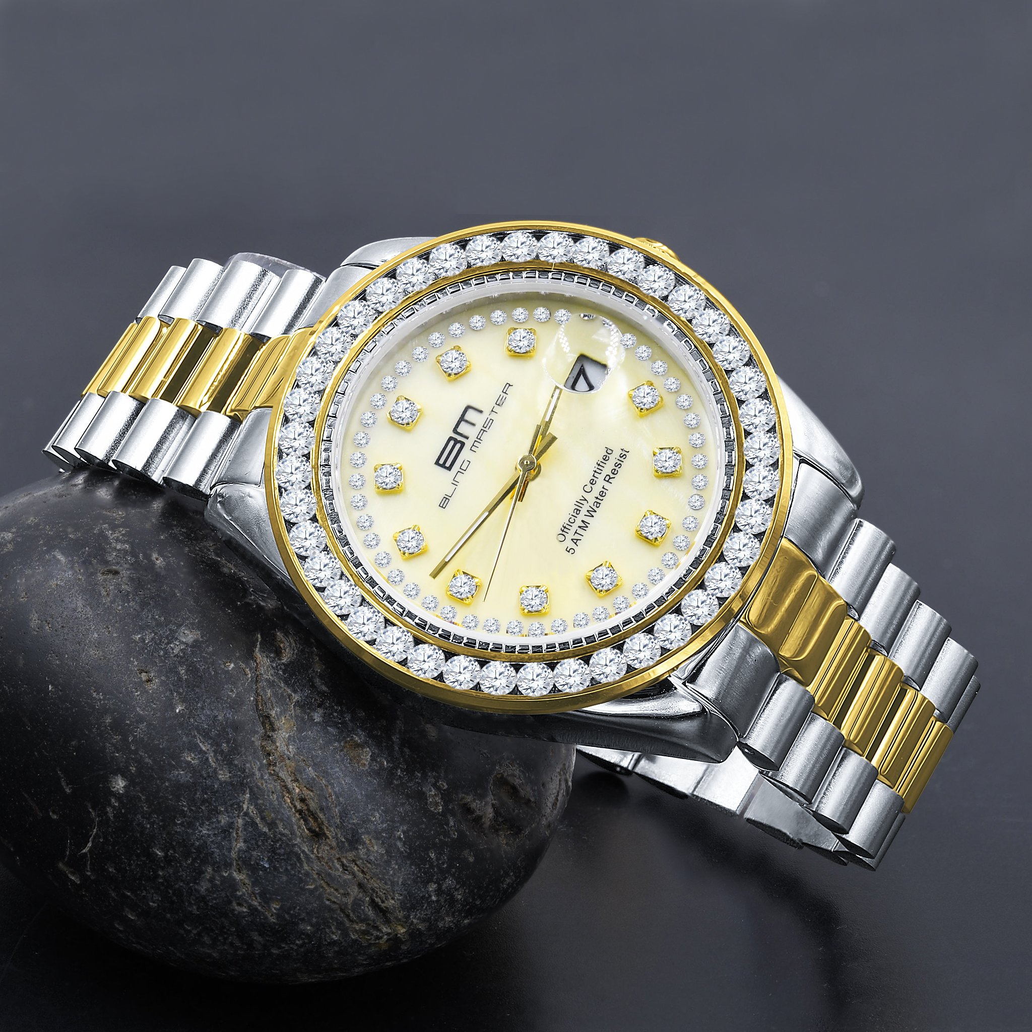 STEALTH Steel Watch featuring a diamond-studded bezel and gold texture, showcasing luxury and elegance.