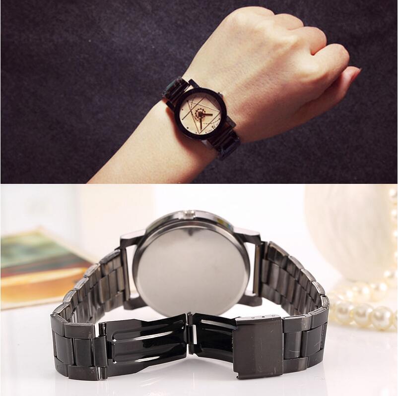 Black metallic wristwatch on hand.