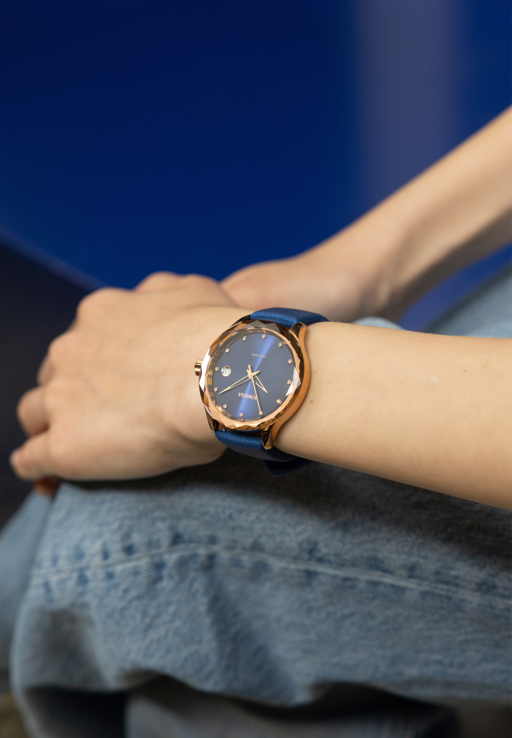 Tiro Swiss Ladies Watch J6.247.M featuring an ocean blue dial, rose gold accents, and a silicone strap, showcasing its elegant design.