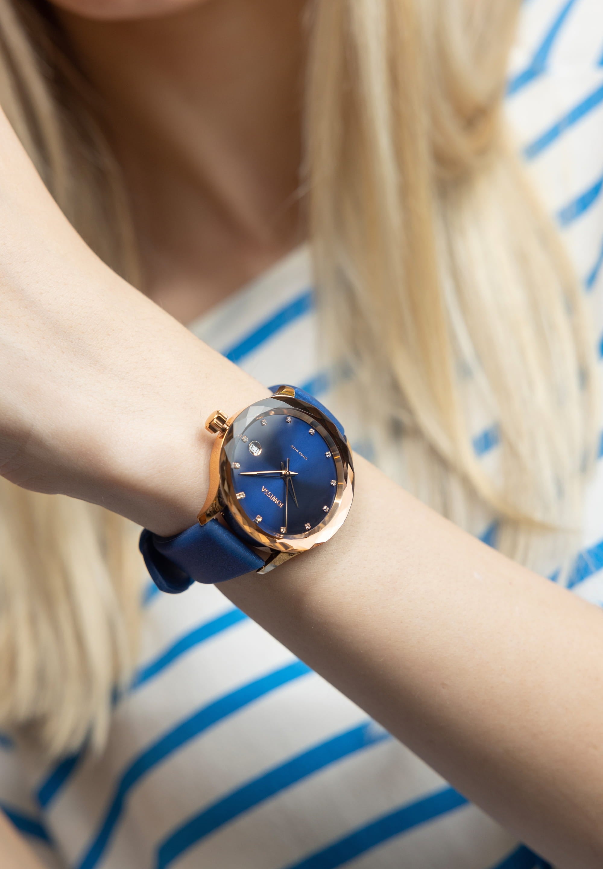 Tiro Swiss Ladies Watch J6.247.M featuring an ocean blue dial, rose gold accents, and a silicone strap, showcasing its elegant design.