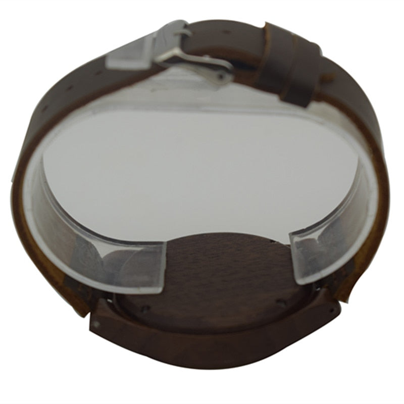 Walnut wooden wrist watch featuring a round dial and leather strap, showcasing its elegant design and craftsmanship.