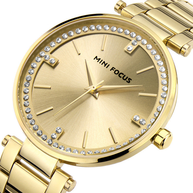 A stylish Women's Quartz Diamond Movement Calendar Waterproof Watch featuring a round dial, stainless steel strap, and diamond accents.