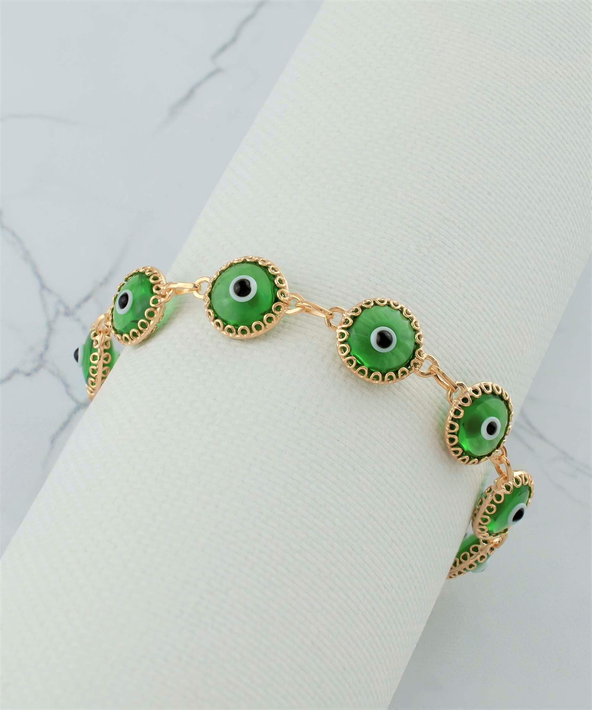 Mint green evil eye bracelet made of gold plated sterling silver with ten beads and a rolo chain design, secured with a lobster claw clasp.