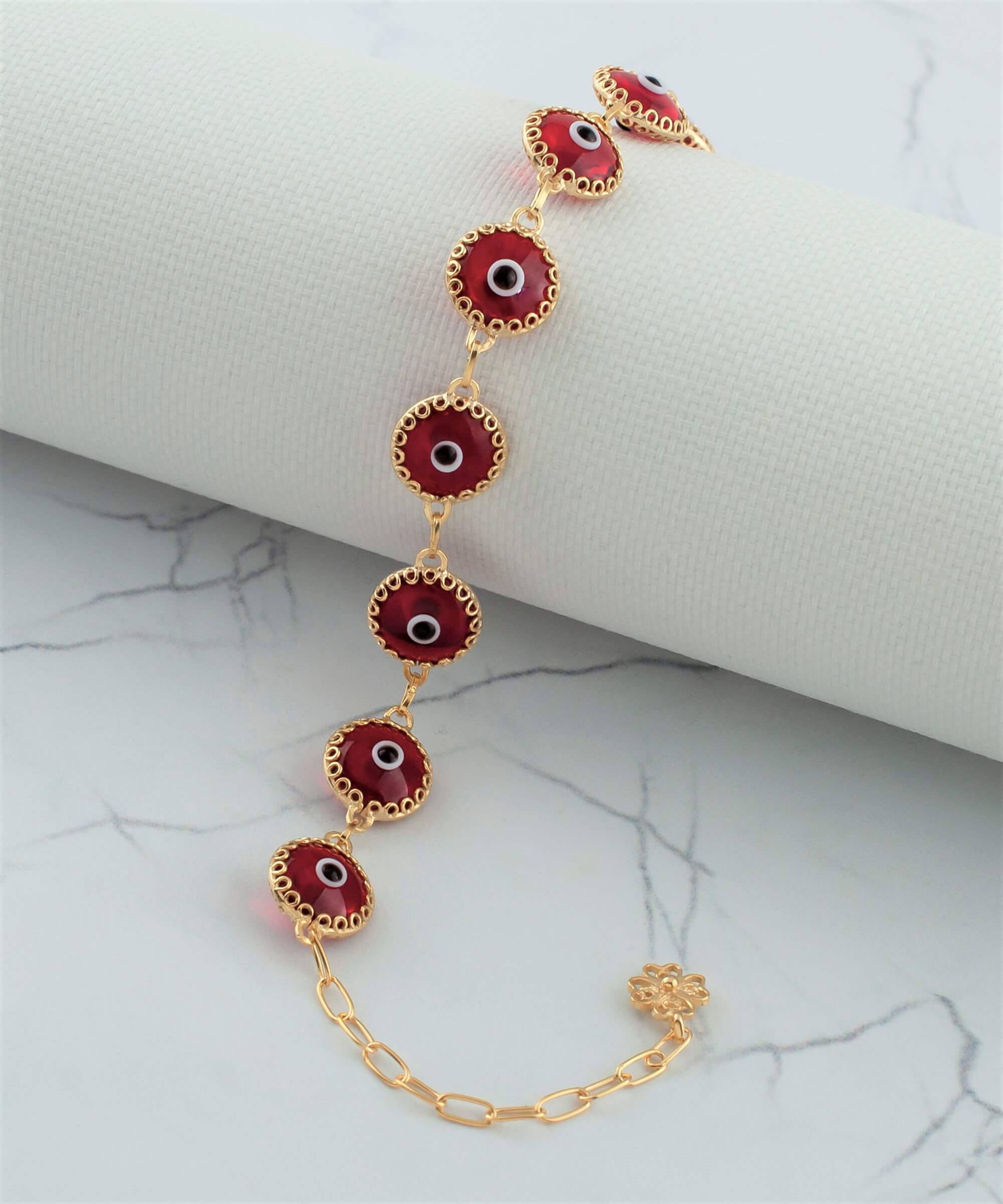 Gold plated sterling silver bracelet featuring 10 red evil eye beads, designed with a strong rolo chain and secured with a lobster claw clasp.