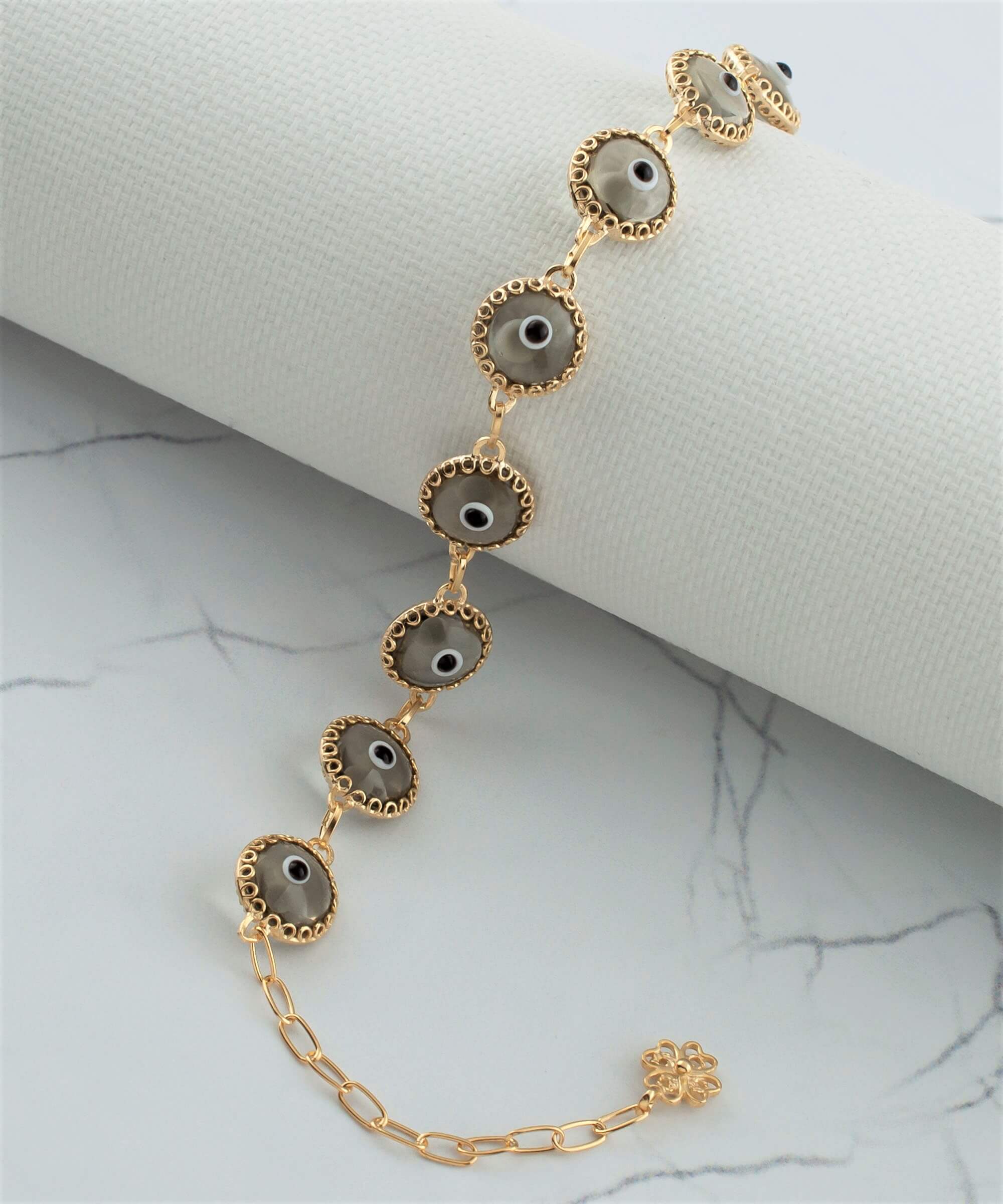 Elegant gold plated sterling silver link bracelet featuring 10 smokey evil eye beads, designed for women with a lobster claw clasp.