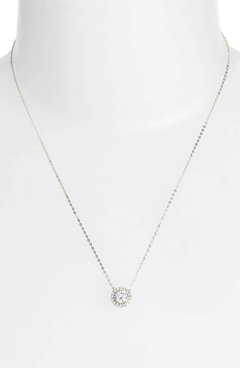 Elegant 1.00 CT Crystal Halo Disc Necklace in 18K White Gold Plated, featuring a sparkling crystal surrounded by a halo design.